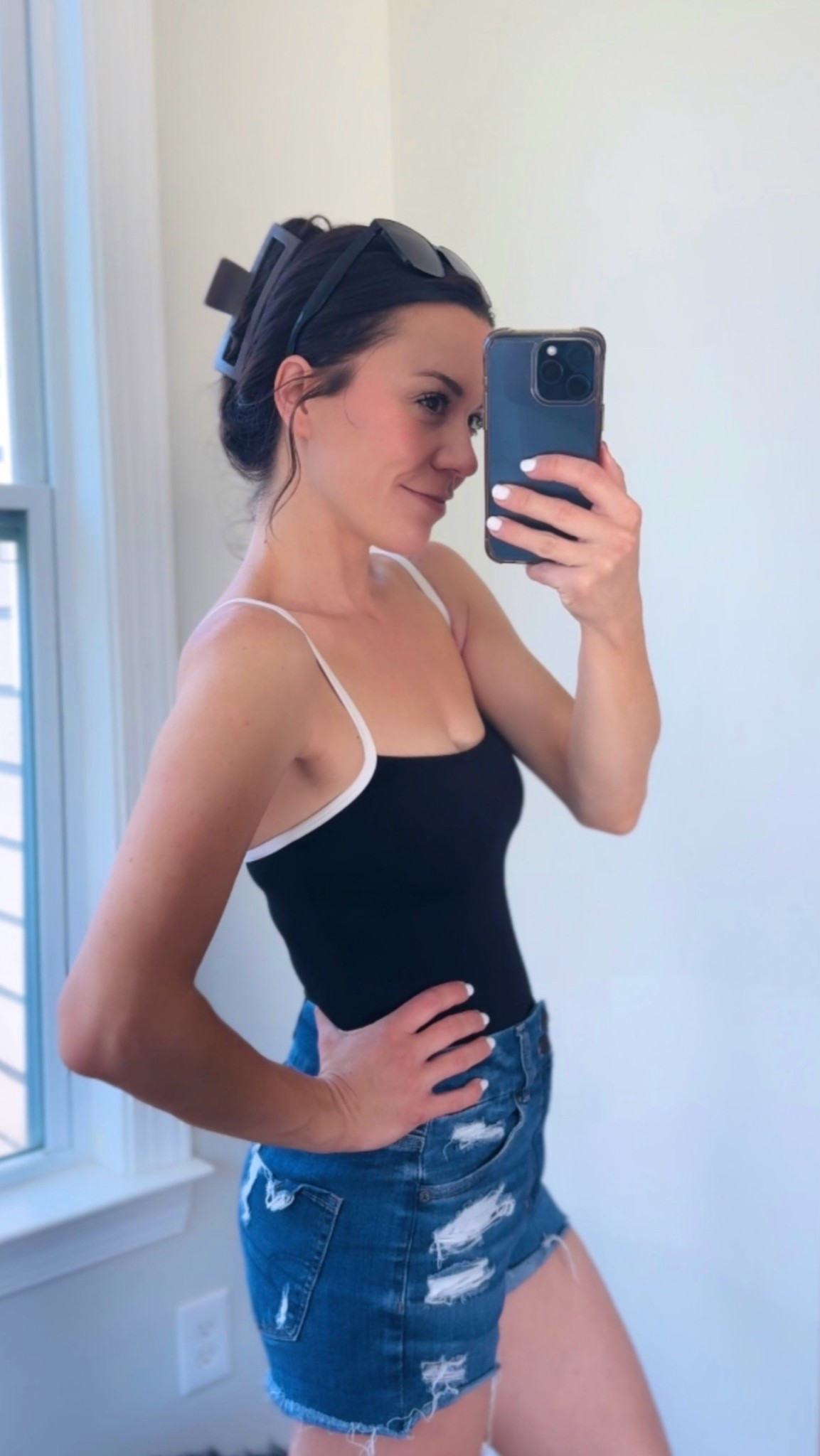 Love this one piece suit so much! Has adjustable straps and a great textured material for smoothing anything you want smoothed haha- and has the cute white strap detail. Just a little elevated black suit! Yes please! 🖤 denim shorts are AE last season - their curvy hi-rise is so stretchy.

#LTKootd #LTKActive #LTKSeasonal