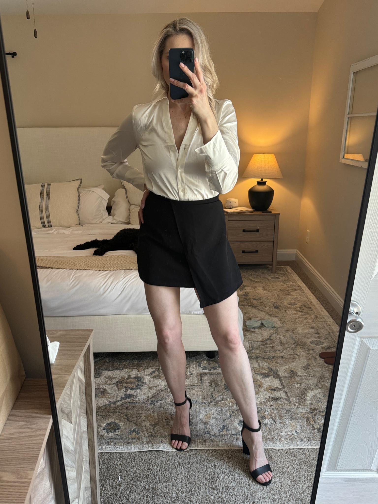 Satin top and black skirt, black heels. 
