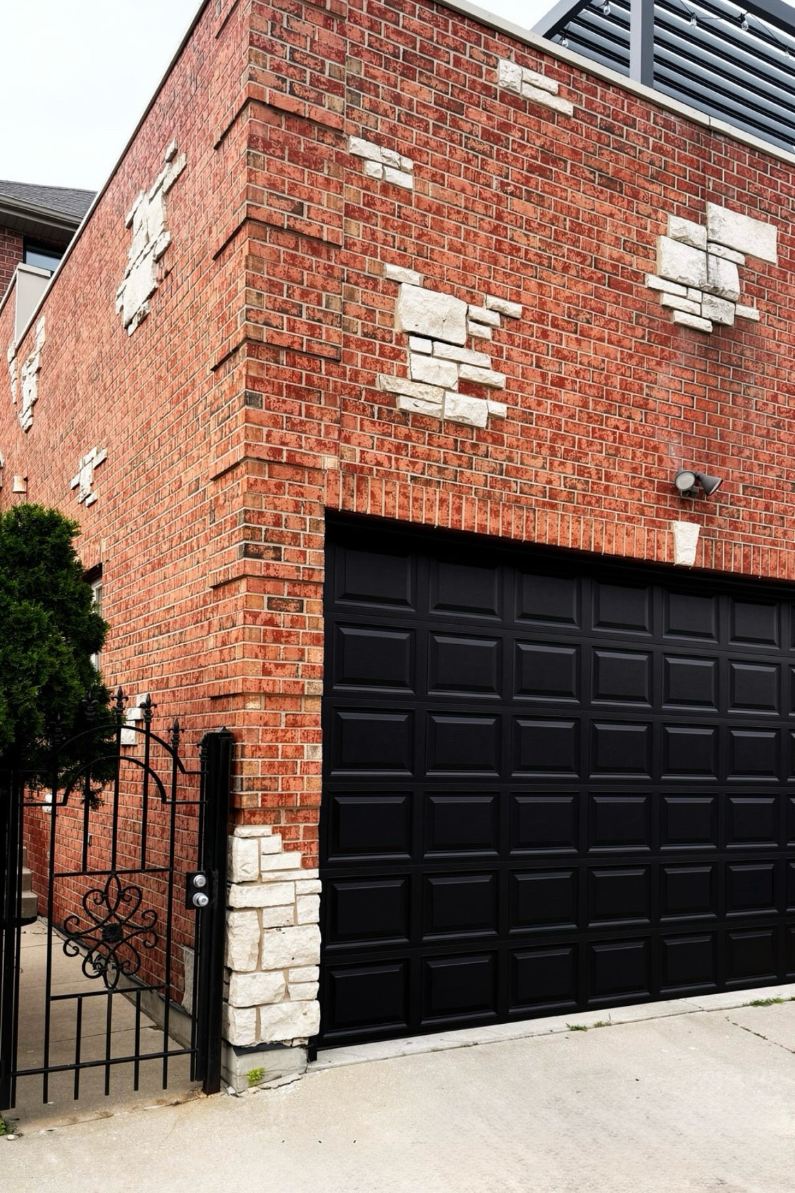 Black eggshell painted garage door for a nice contrast against brick home

#LTKHome