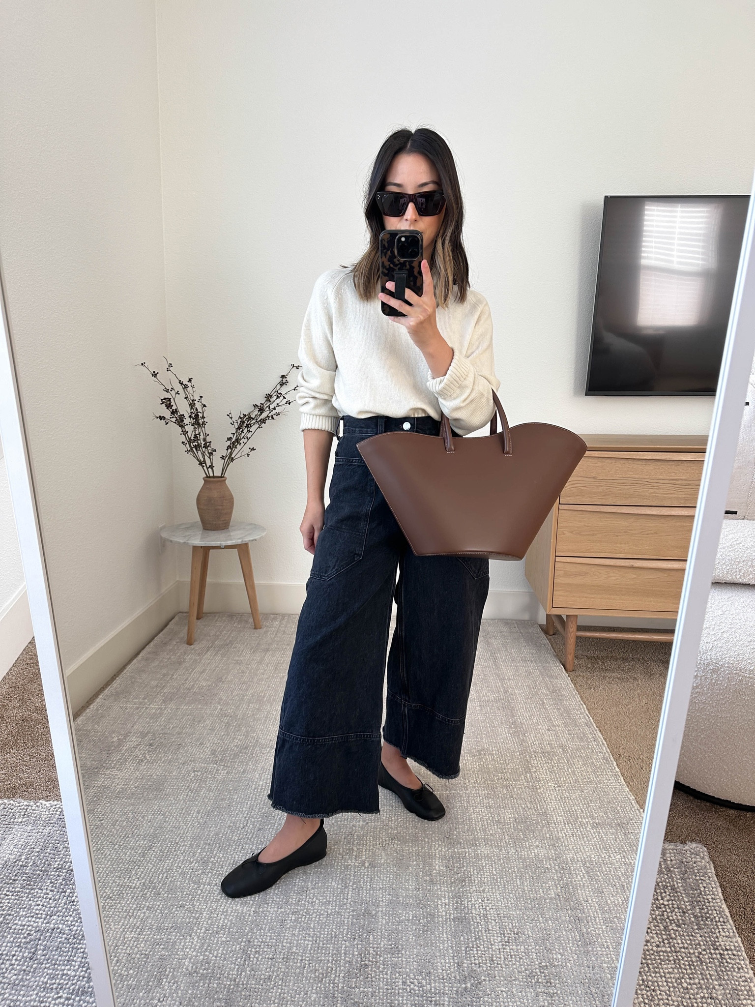 Everlane boxy cashmere sweater. These are so classic. Come an an array of neutral colors - I want all
Of them! Runs short but great for easy tuck ins. Sleeves do run big. 

Everlane sweater xs
Everlane jeans. 25. Sized up and cut hems. 
Everlane flats 5
Little Liffner tote. Linked larger size. 
Celine sunglasses 

#LTKitbag #LTKSeasonal #LTKshoecrush