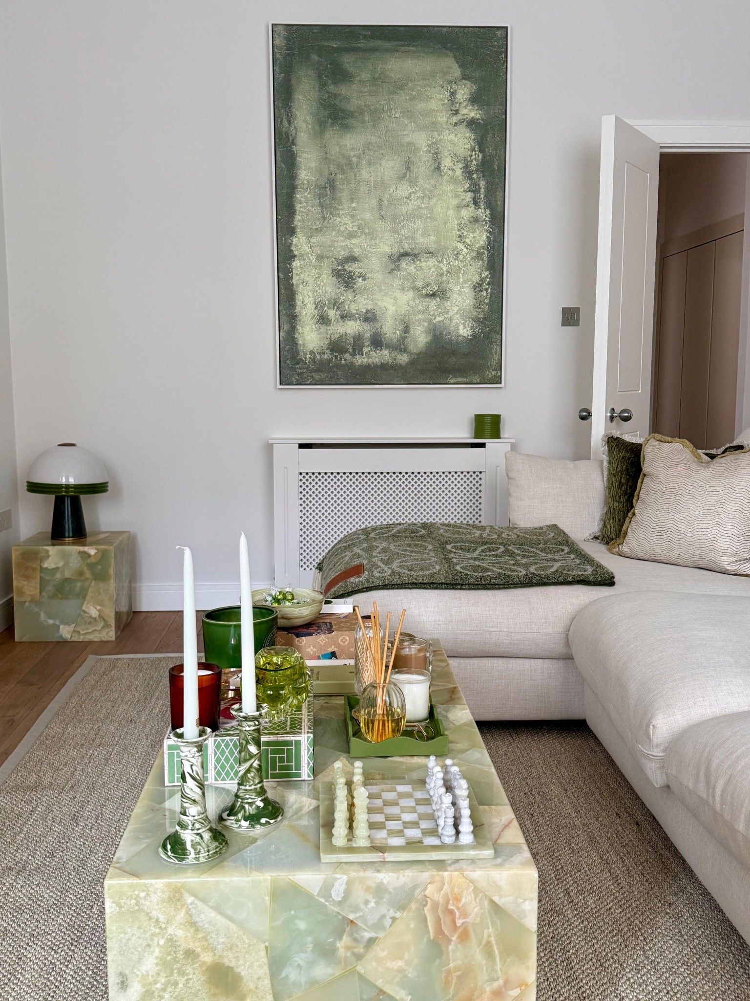 green detailed lounge / London flat / living room / coffee table / home decor / decorative / marble candle sticks / diptyque / soho home / Loewe blanket / coffee table books / spring 

#LTKeurope #LTKspring #LTKuk