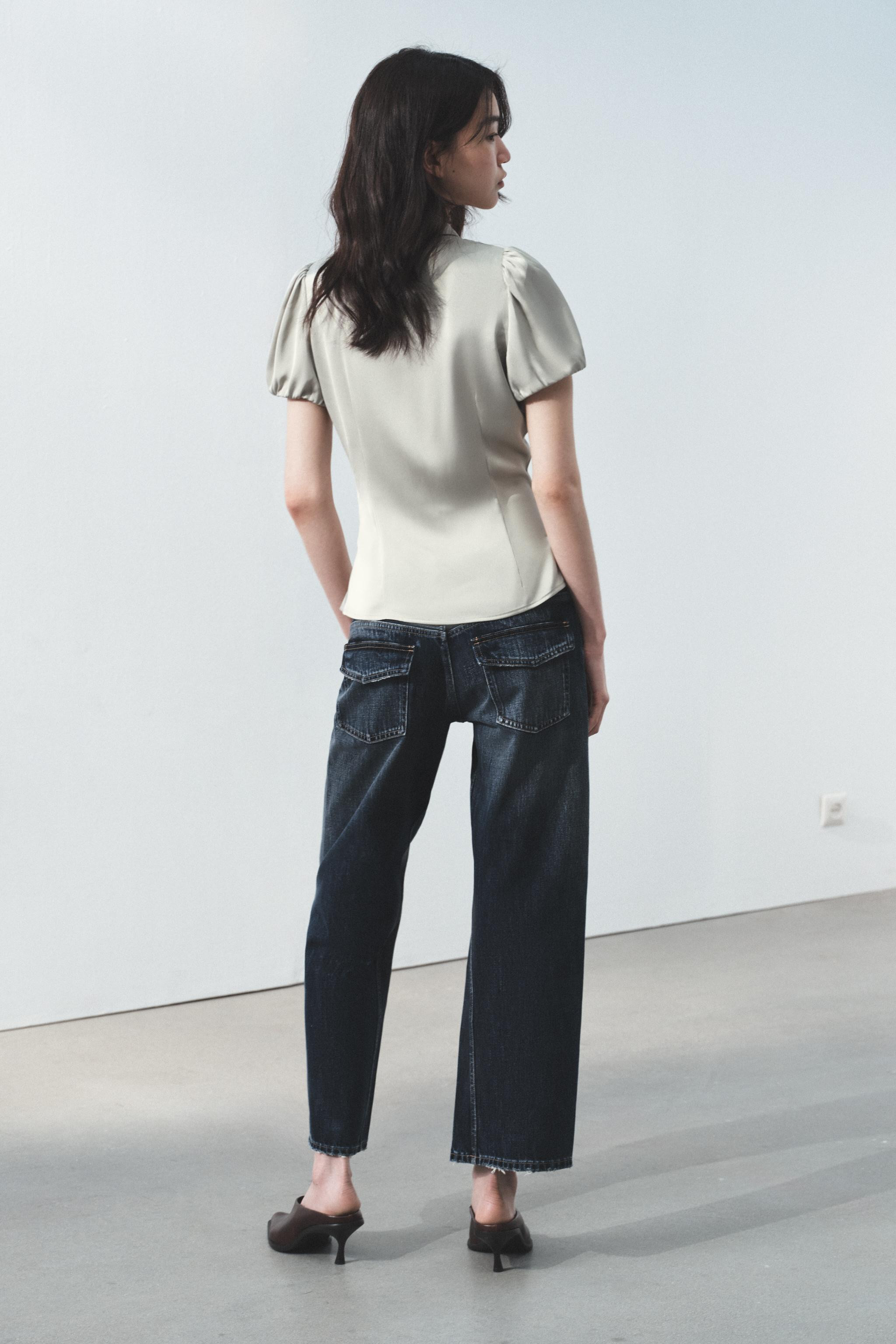 Collared shirt with puffed short sleeves. Featuring side vents at the hem and a press-stud fasten... | Zara DE