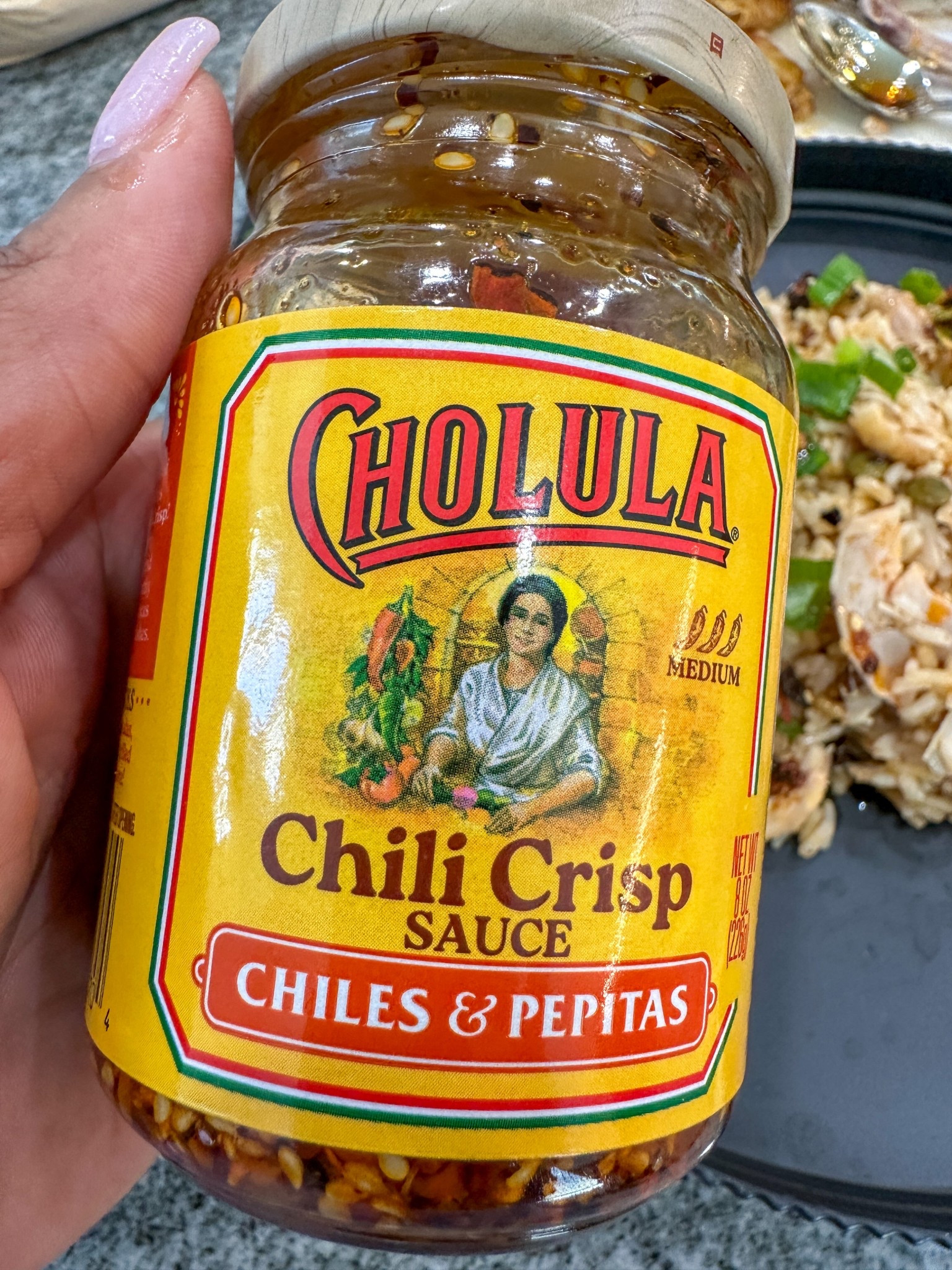 Cholula Chili Crisp Sauce with Chiles & Pepitas. The perfect Crunchy Topping for rice dishes, Tacos, Tostadas, Eggs, Pizza and More. #chilicrisp #cholula #productinfluencer 

#LTKfoodie
