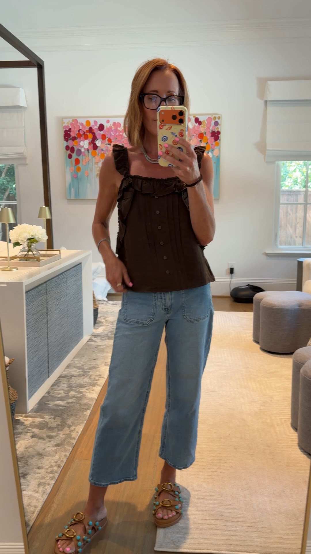This brown ruffle trim sleeveless button front top is sold out but I found two nearly identical options that give the same effortless summer casual look — the ruffle shoulder detail and button front silhouette is such a flattering and feminine top style that works for everything from a summer date night outfit to a casual weekend look over 40. The Quince light wash wide leg cropped jeans with the patch pocket detail are such a great affordable denim find that fits beautifully and the raw hem crop length is perfect for showing off a fun sandal. The embellished turquoise and gold buckle sandals finish the whole look and are the kind of statement shoe that makes a simple summer outfit feel completely intentional.

#LTKootd #LTKSaleAlert #LTKOver40