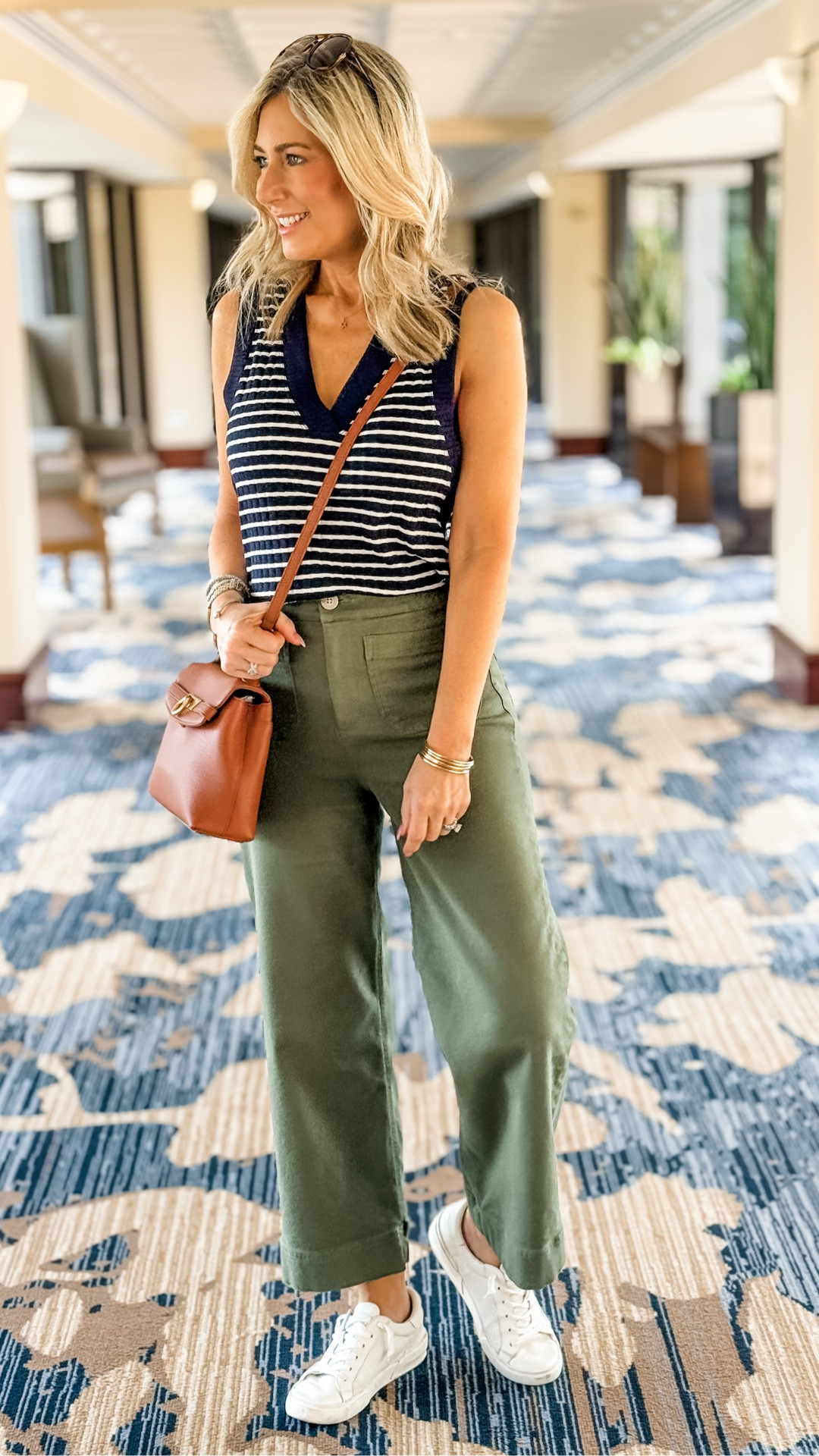 If you’re thinking about pairing certain colors that work well to transition into fall, navy and olive green make a great combo! This sleeveless v-neck top also comes in quite a few other shades and the pants do as well. Both run true to size. The pants have some nice softness and stretch to them so they’re easy to wear all day long. Wearing both pieces in size XS for reference. The sneakers run big-size down ½ size!

Late summer outfit, casual outfit, fashion over 50, fall outfit 

#LTKOver40 #LTKStyleTip