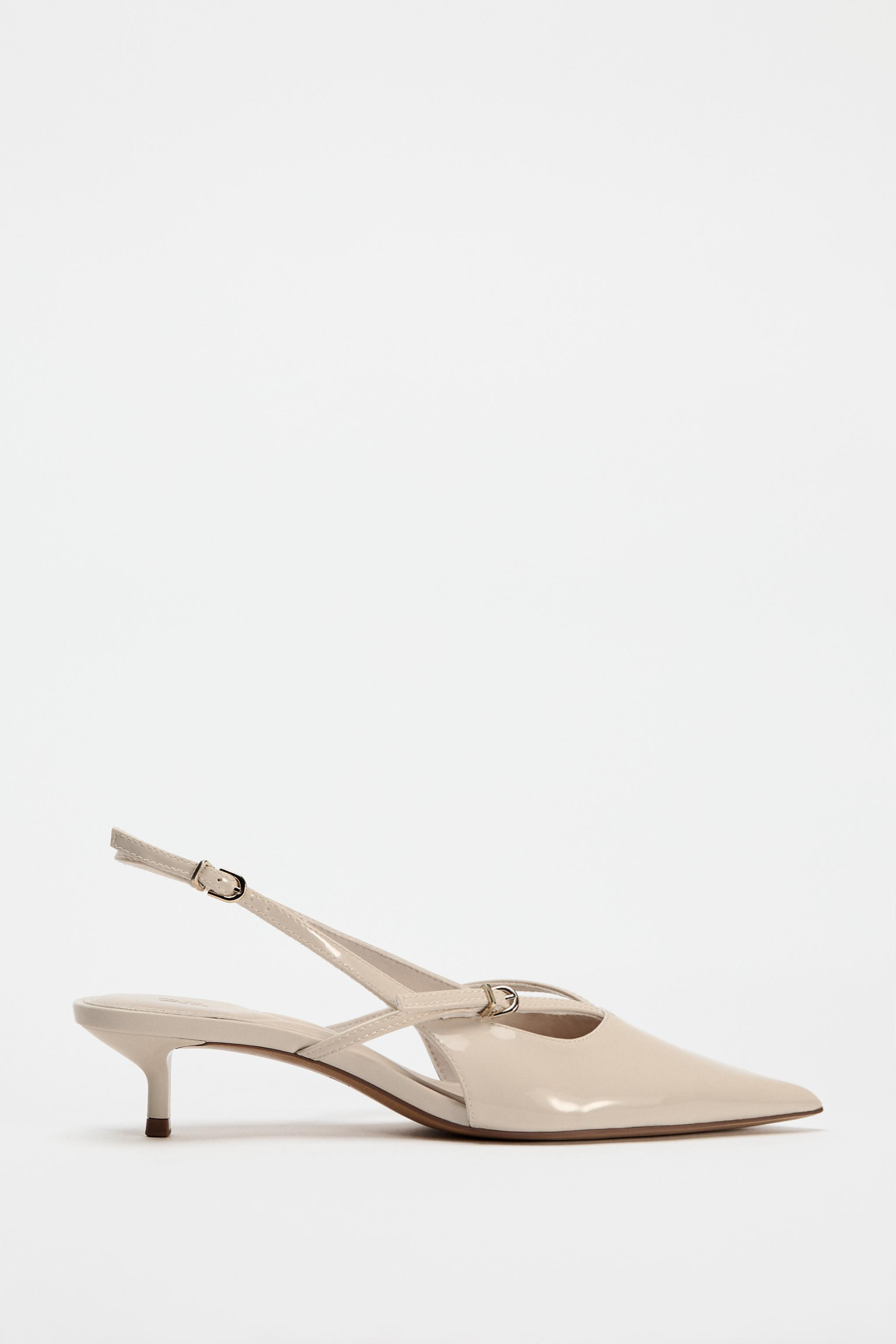 Slingback kitten heels. Faux patent leather finish. Thin front straps. Ankle strap with buckle c... | Zara US