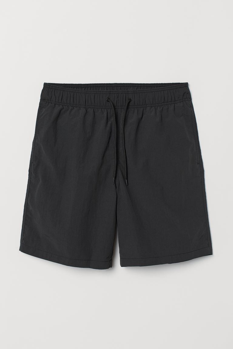 Swim shorts in woven fabric with an elasticized drawstring waistband, side pockets, and back pock... | H&M (US)