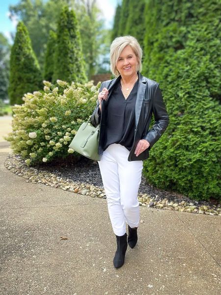Black and white is a classic combo! I love wearing white pants because they go with just about everything. 

Black booties | olive green handbag | black faux leather blazer | white Spanx pants | black drapey top

#LTKworkwear #LTKstyletip #LTKunder100