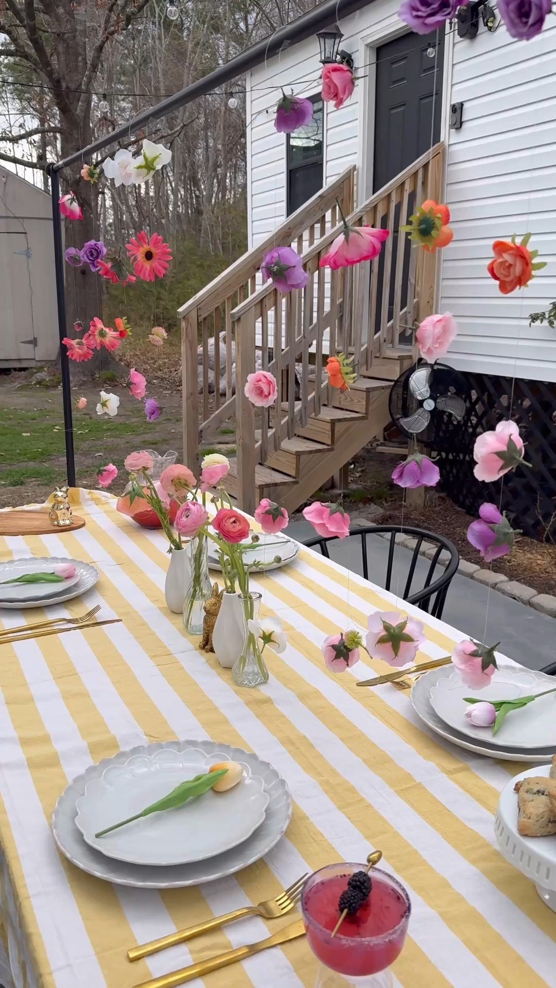 How to Create Floating Flower Garlands with Fishline

I’ve seen a lot of different ways to do this, but personally, I just took my fishing line and tied it around the base of the faux flower, making a complete loop underneath it’s “faux stem”. I then made a double knot for a little more security.  Move down about 6-8 inches, and tie the next flower to your string. 

I trimmed my flowers, and then tied them on while watching a movie. This is actually a really simple craft, with incredibly high impact. 