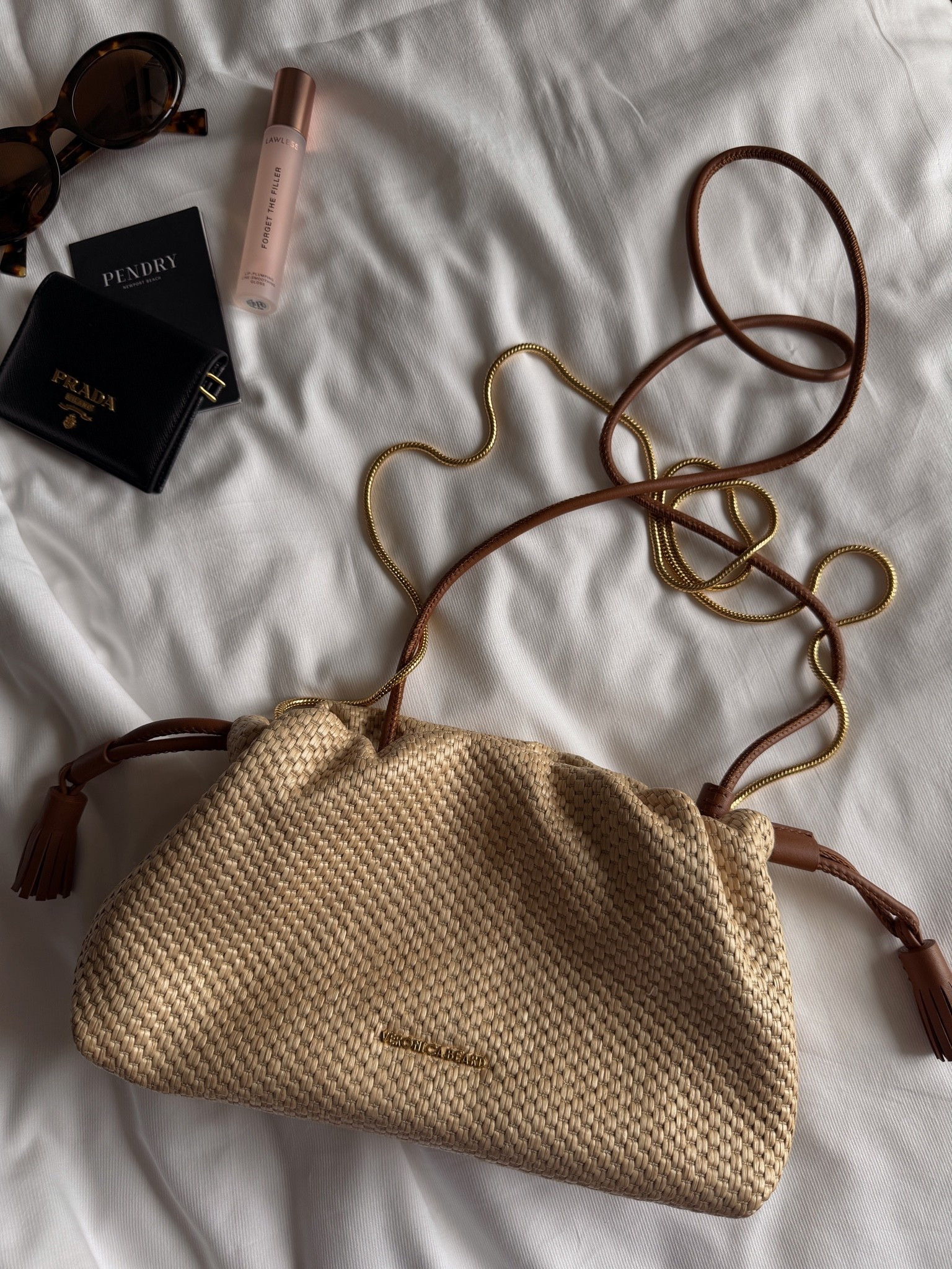 Veronica beard understood the assignment and came out with the prettiest raffia bag that is perfect for day or night with two removable straps in gold chain and brown leather or you can wear it as a clutch. Super roomy and chic @Shopbop @Veronica Beard

#LTKSeasonal