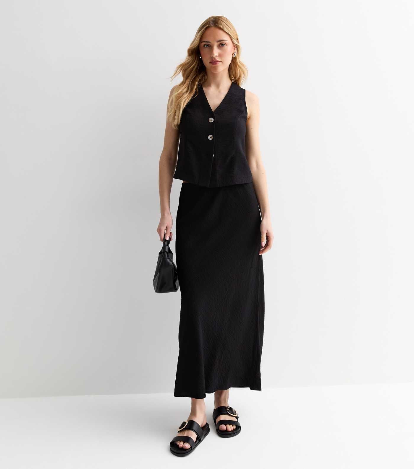 Black Textured Midi Skirt
						
						Add to Saved Items
						Remove from Saved Items | New Look (UK)