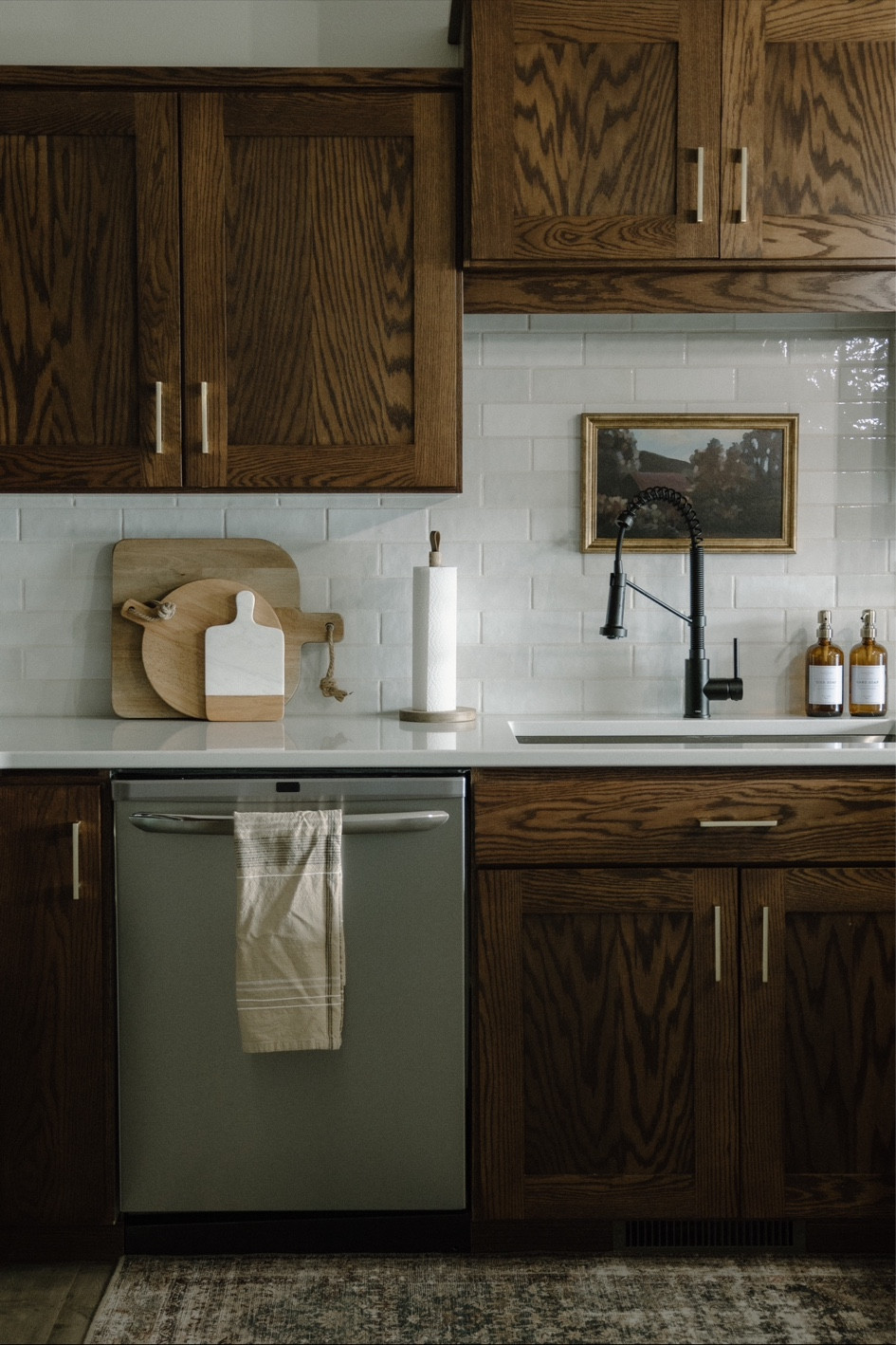 Walnut kitchen cabinets, kitchen inspo, Alexander James ceramic white handcraft tile, white kitchen backsplash, Zellige tile, kraus matte black kitchen faucet, white quartz countertops, vicostone Aspen, studio McGee barstools, black barstools, brass hardware, brass cabinet pulls, kitchen cookbooks, outlet covers 

#LTKstyletip #LTKhome