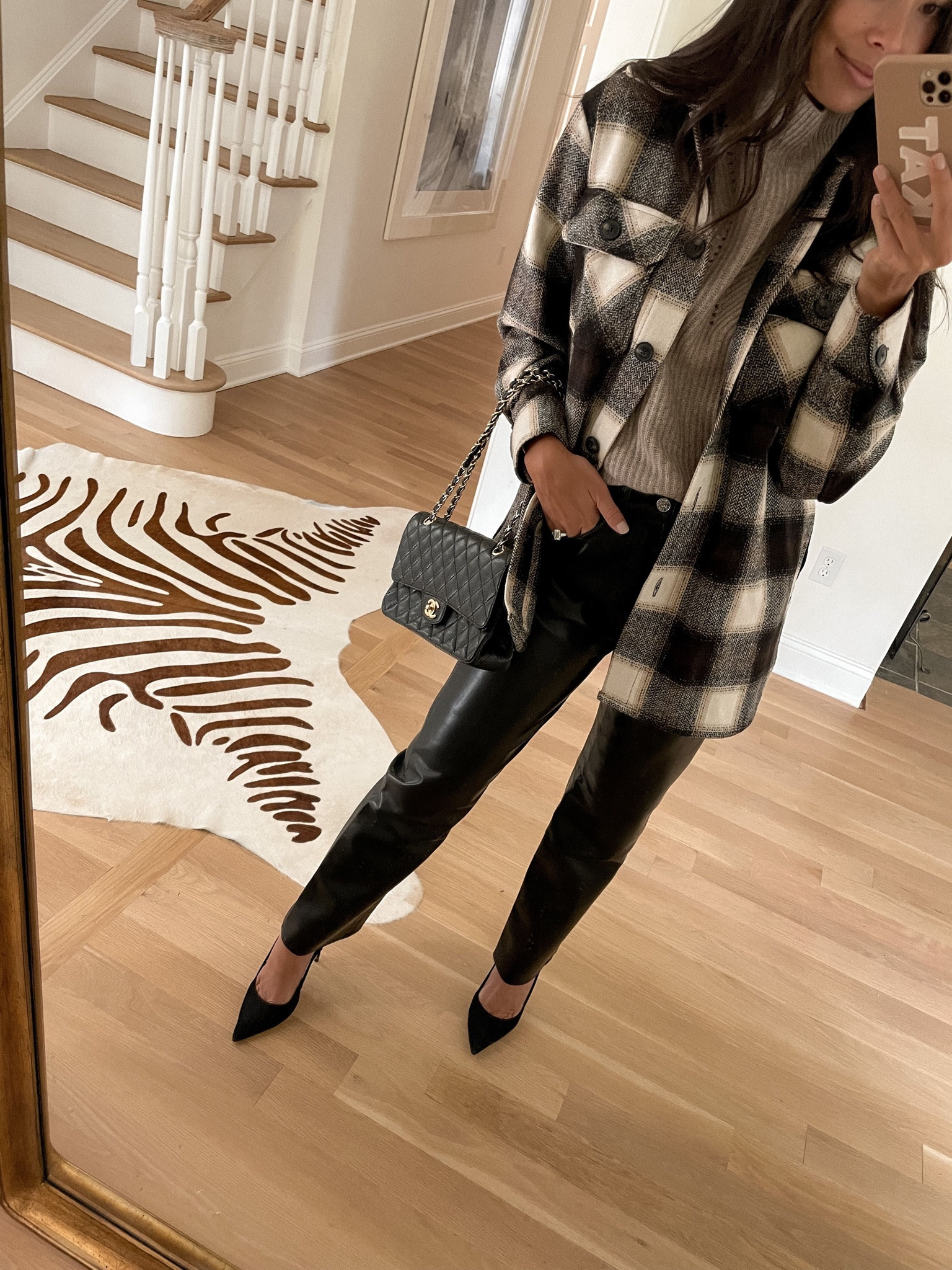 Kat Jamieson of With Love From Kat wears a fall outfit. Neutral sweater, plaid jacket, black leather pants, black suede heels, fall style. 

#LTKSeasonal #LTKstyletip