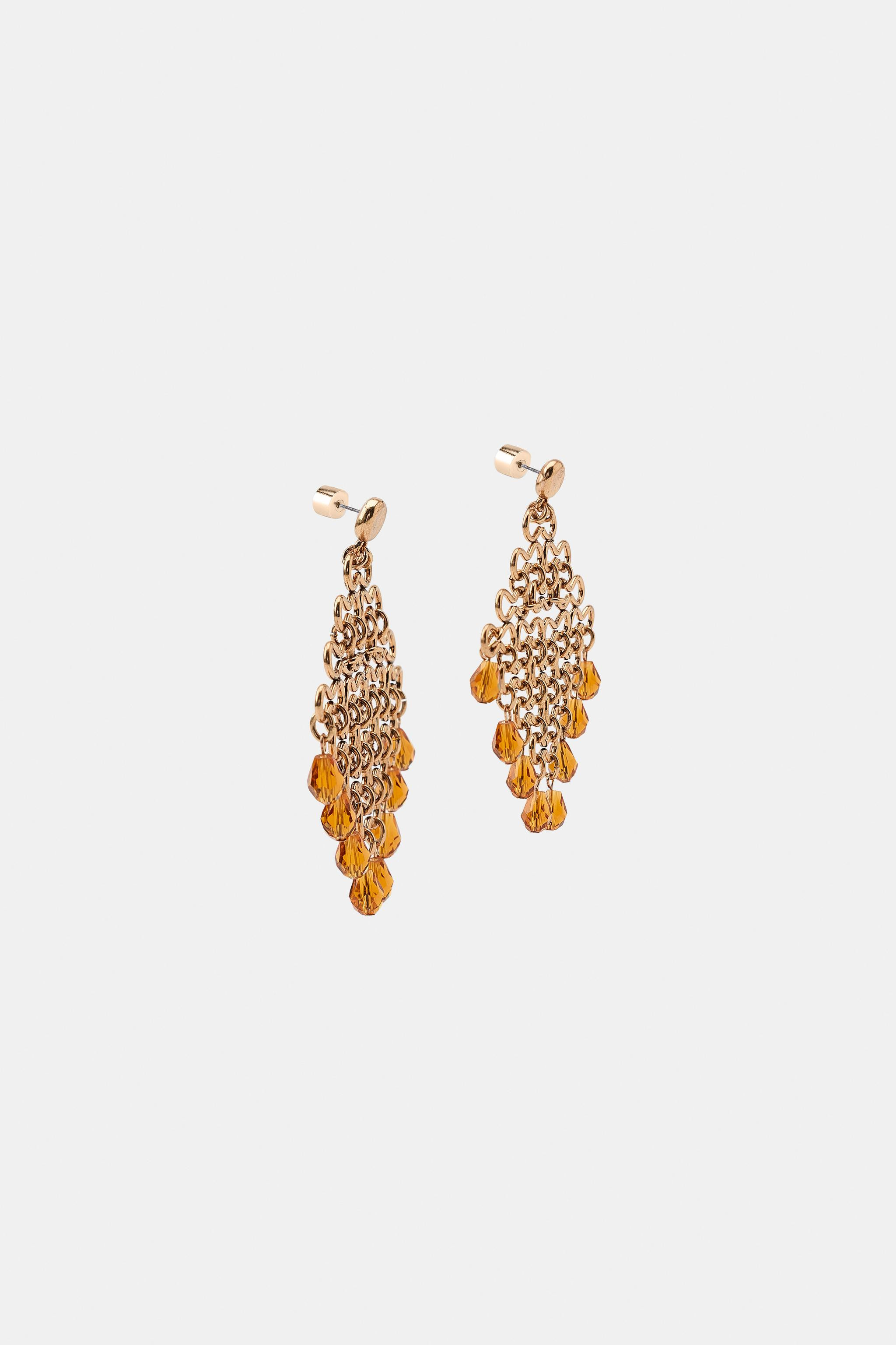 Model height: 181 cmMulti-piece metal earrings featuring a contrasting beaded pendant. Push-back ... | Zara UK