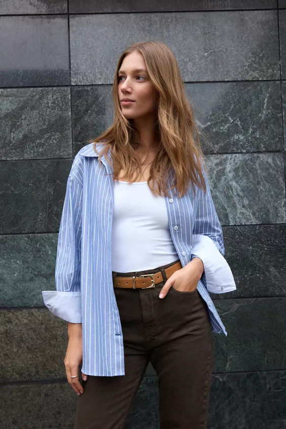 V-neck lapel collar shirt with long sleeves. Front button closure. | Zara US