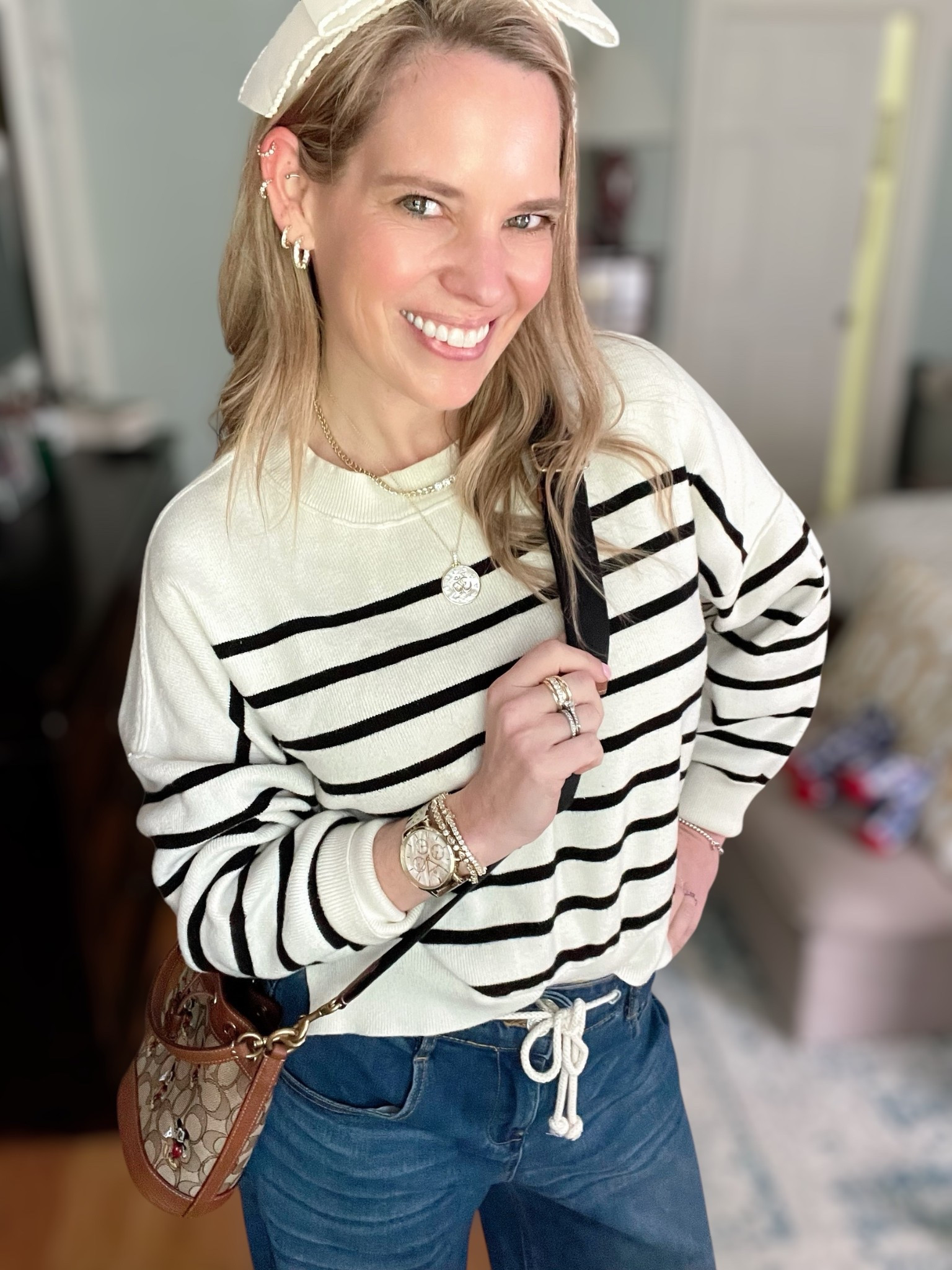 Use code ASHLEYBA for 10% off all Melinda Maria jewelry + FREE 1” Diamondette Hoops with purchase through 4/15! ✨💎

This classic-meets-coastal outfit is all about comfort, polish, and a touch of sparkle 🖤🤍🌊. I’m wearing a lightweight striped sweater, wide-leg denim with a drawstring waist, and the ultimate spring accessories — including a bow headband, leopard heels for a pop of print, and Melinda Maria favorites that elevate it all ✨👜

Melinda Maria Jewelry Details:
	•	Coin pendant necklace with celestial sparkle 🌙✨
	•	Tennis choker layered for just the right amount of glam 💫
	•	Stacked rings in gold + diamondette for that “collected over time” look 💍
	•	Tennis bracelets on repeat — classic, polished, and versatile
	•	1” Diamondette Hoops — FREE GWP through 4/15!

Styled with an engraved Abbott Lyon watch, a beaded Coach camera bag, and playful layers that keep the look cool, coastal, and put together for errands, brunch, or travel days.

wide leg jeans outfit spring, classic striped sweater look, elevated casual outfit 2025, coastal chic spring fashion, Melinda Maria coupon code, free gift with purchase jewelry, everyday jewelry stack, tennis bracelet layered look, Coach camera bag with beaded strap, leopard heels outfit, casual glam outfit idea

#LTKFindsUnder50 #LTKFindsUnder100 #LTKOver40