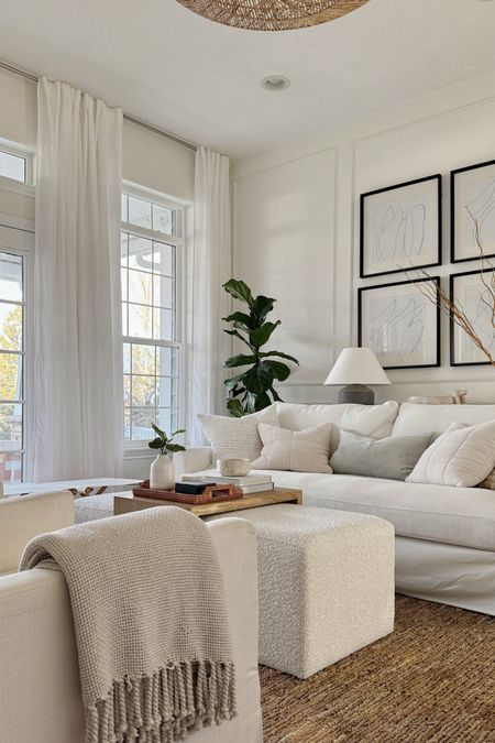 Keeping things light and neutral in the living room for winter into spring - living room decor - coffee table - ottoman - jute rug - swivel chairs - white sofa 

#LTKfindsunder100 #LTKhome #LTKSeasonal