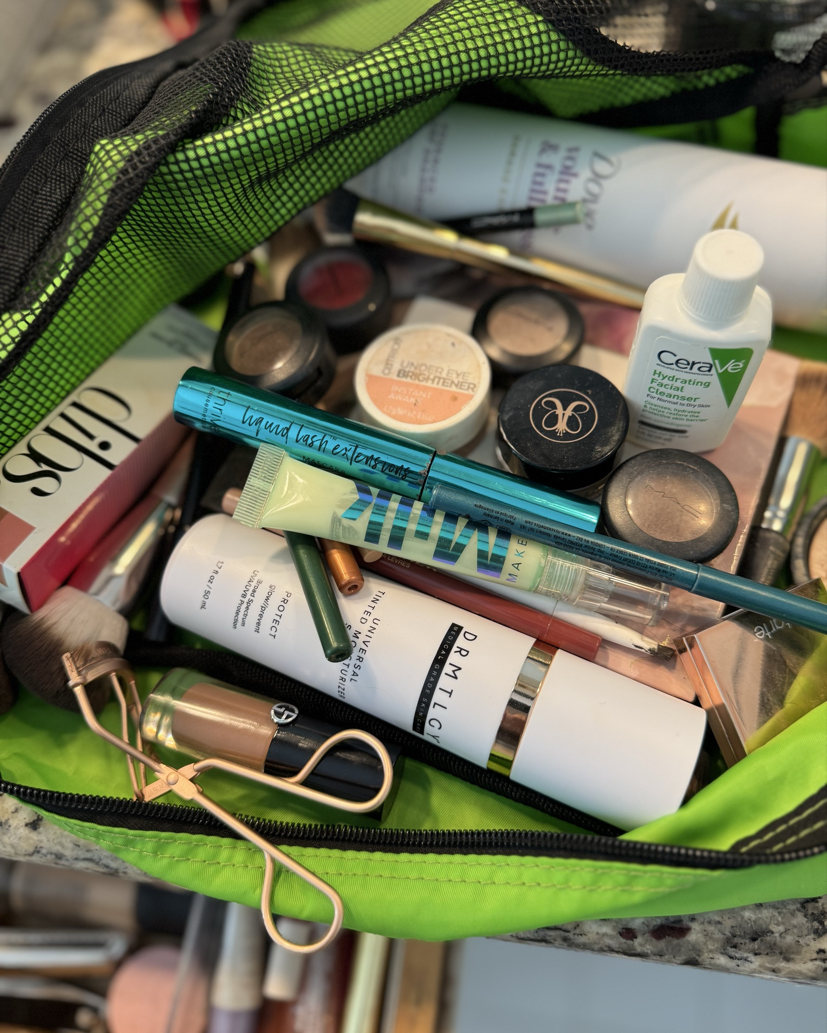 What’s in Christina’s very unorganized travel makeup bag you ask?? Only my faves! Look away if it’s too messy for you 🤣 but then you’d miss my list of faves … tough choices to make!
1. DRMTLGY’s tinted moisturizer with SPF- very light weight!
2. MILK’s primer- my makeup stays put all day!
3. The Dibs duel ended blush/bronzer stick bc we all need that touch up ( smells like Vanilla)
4. Dove dry shampoo- smells wonderful!
5. My Armani liquid eyeshadow- color 22- 
6. Thrive tubing mascara 
7. Eye brighter for those long days
8. Cerave cream to foam face wash
9. Anastasia’s stay put brow stuff

So as you can see there’s SO much - this just scratches the surface of the essentials needed for travel 🤣

#drmtlgy#milk#cerave#dibs#thrive#dove#armanibeauty

#LTKgrwm #LTKdayinmylife #LTKBeauty