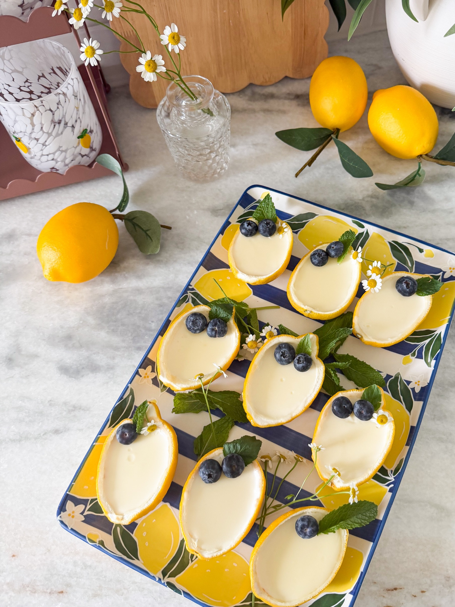 Here’s the lemon posset recipe 🍋💛

you’ll need:
• 8 lemons (for the cups + fresh juice)
• 2 cups heavy cream
• 2/3 cup sugar (adjust to taste—add more if you like it sweeter)
• 8 tbsp fresh lemon juice
• optional: lemon zest + a splash of vanilla

slice the lemons in half and scoop out the inside.
use a strainer to press the pulp so you get fresh lemon juice

in a saucepan, bring the cream + sugar to a gentle boil and let it simmer a few minutes, then remove from heat
immediately stir in the lemon juice (and vanilla if using)

let it sit about 5 minutes, then strain if needed and pour into your lemon halves

chill for at least 3–5 hours (i did overnight)

that’s it 🤍

top with berries, mint, flowers, or even brûlée the tops if you want to dress them up ✨


#LTKfoodie #LTKSeasonal #LTKHome