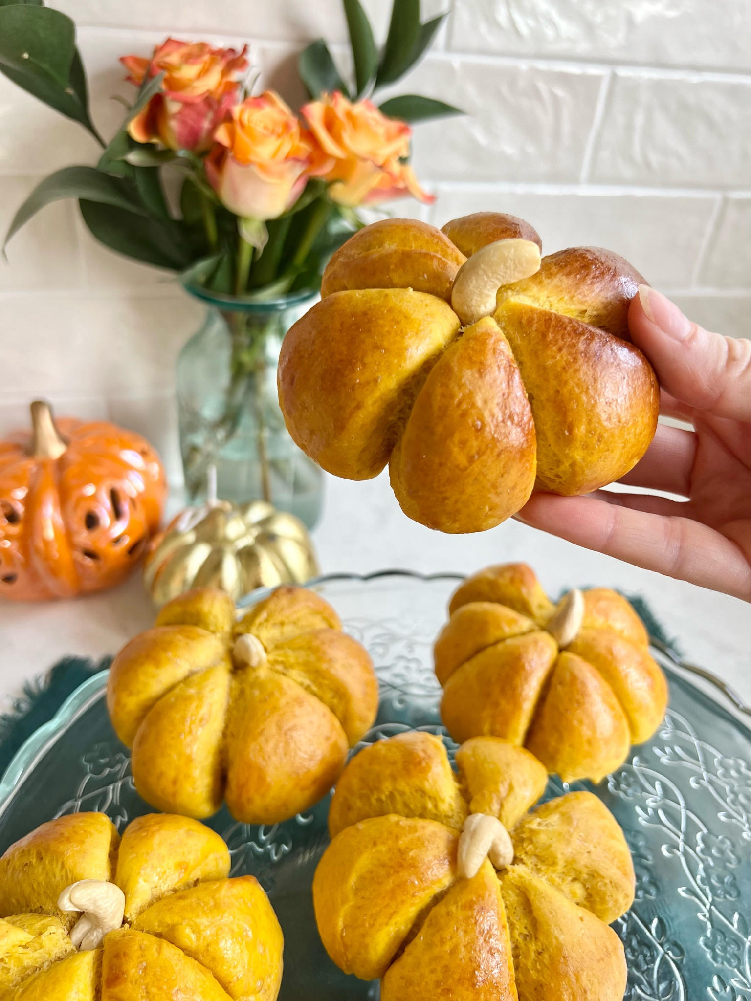 🍂🎃 Pumpkins in October? How novel. But these little rolls are fun to make and delicious to eat. It’s soup season, so get dipping! 🥣🍂

Makes 8 mini pumpkin rolls:

- 130g pumpkin purée (if you’re in the UK, the tins can often be found in international food stores)
- 150ml warm whole milk 
- 7g dried active yeast 
- 60g melted butter 
- 1 tsp salt 
- 375g plain flour
- 1 egg (for egg wash)
- Handful of cashew nuts 

1. Mix the warm milk with the melted butter, salt, pumpkin purée and yeast, and give it a good stir. 
2. Add the flour and mix until it comes together into a dough.
3. Knead on a lightly floured surface for around 10 minutes until smooth. If it’s too sticky you can add a little extra flour but not too much, and it should become less sticky as you knead. 
4. Form into a ball, and leave in a lightly oiled, covered bowl for around 1 - 1.5 hours until doubled in size. 
5. Pinch down the dough and divide quality into 8 balls (around 85-90g) 
6. Use string to loosely tie around the pumpkins to divide them into 6 segments. You can do this with 3 pieces of string, or with 1 long piece that wraps around, whatever you find easiest. 
7. Cover loosely with cling film, and leave to prove for another half an hour, until the pumpkin shape has formed. 
8. Meanwhile preheat the oven to 190°C. 
9. Mix the egg with 1 tbsp water and brush the rolls with egg wash.
10. Bake for around 25-30 minutes until a lovely golden brown. 
11. When cool enough to touch, cut off the string and poke a hole in the top to add the cashew nut. 
12. Enjoy! 🎃


#LTKHalloween #LTKSeasonal #LTKhome