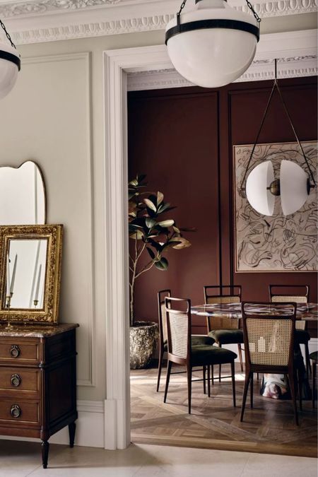 Marble dining table, cane dining chair, globe light, marble top dresser, abstract art, assymetrical mirror, gold mirror 

#LTKstyletip #LTKsalealert #LTKhome