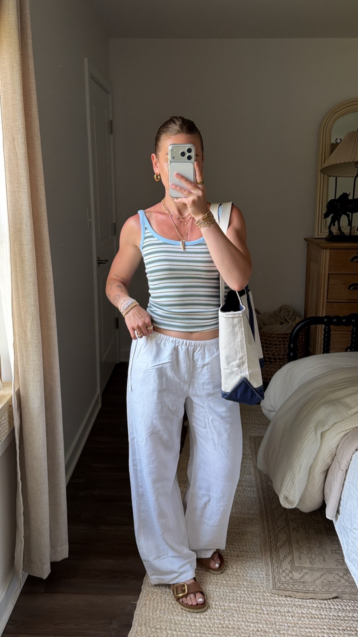 4/16/26 Casual Spring to Summer Outfit


An easy outfit I’ll be wearing all spring into summer 🤍 light linen pants from Aritzia, a striped scoop neck tank, and my Birkenstock big buckle sandals. Finished with my L.L. Bean boat and tote (medium) for that effortless, everyday feel—everything is linked here ✨

#LTKootd #LTKxAerie #LTKSeasonal