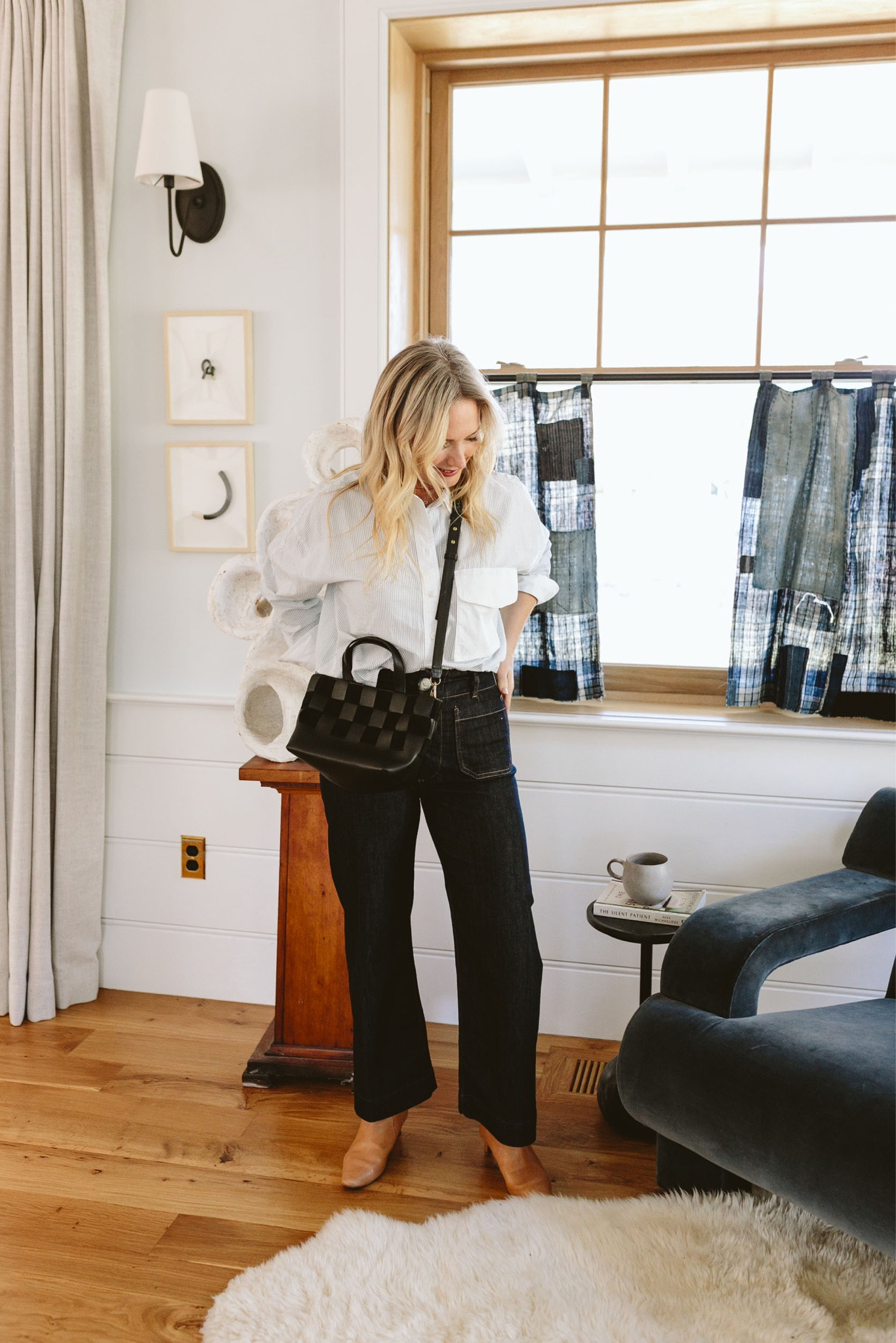 These are the famous Colette pants in denim from Anthropologie that come in a million washes and colors (and multiple people in my life have told me they are their favorite jeans ever). I get the hype now and I can tell you the #1 reason why they are so popular – front square pockets are really really flattering. Also, that blouse is so cute.