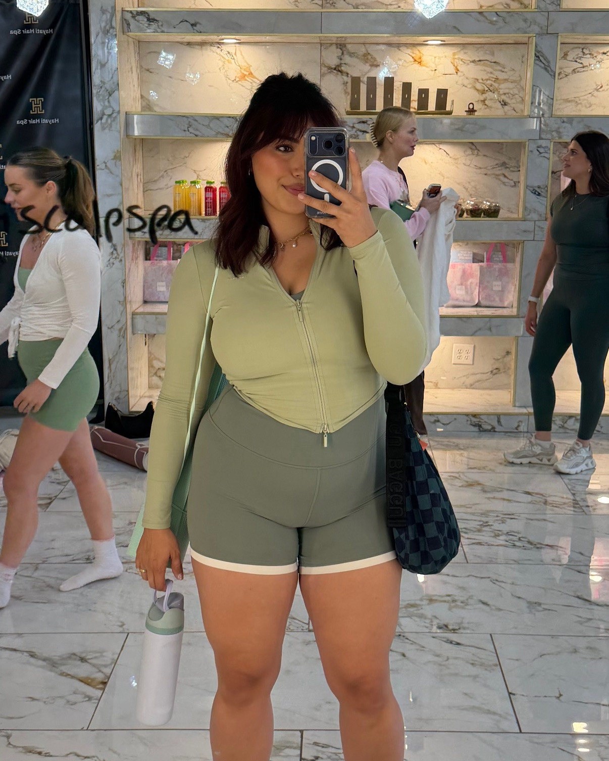 new sage green activewear set from lululemon paired with a young la for her athletic jacket & new balance tennis shoes! wore this to a pilates class! I got a size 12 in the biker shorts and sports bra and a medium in the jacket! currently 203lbs, 5’6/5’7!