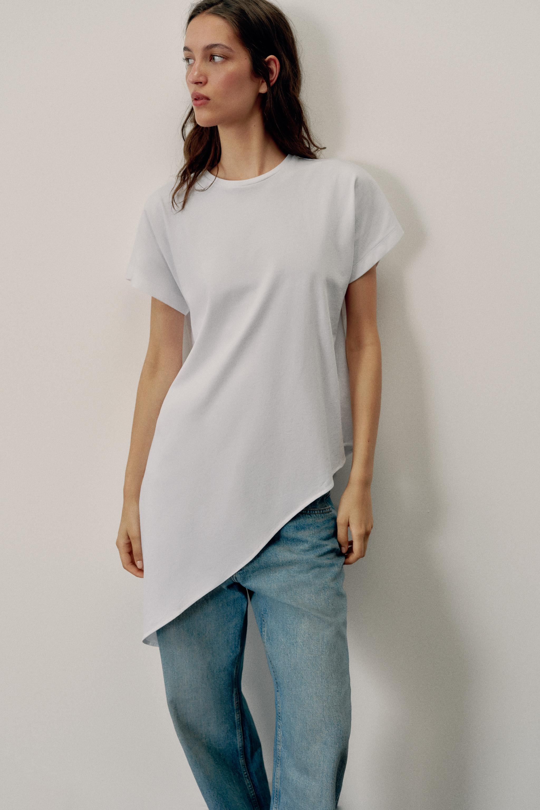 Model height: 183 cmREGULAR FIT - ROUND NECK - ASYMMETRIC LENGTH - SHORT SLEEVET-shirt crafted fr... | Zara UK