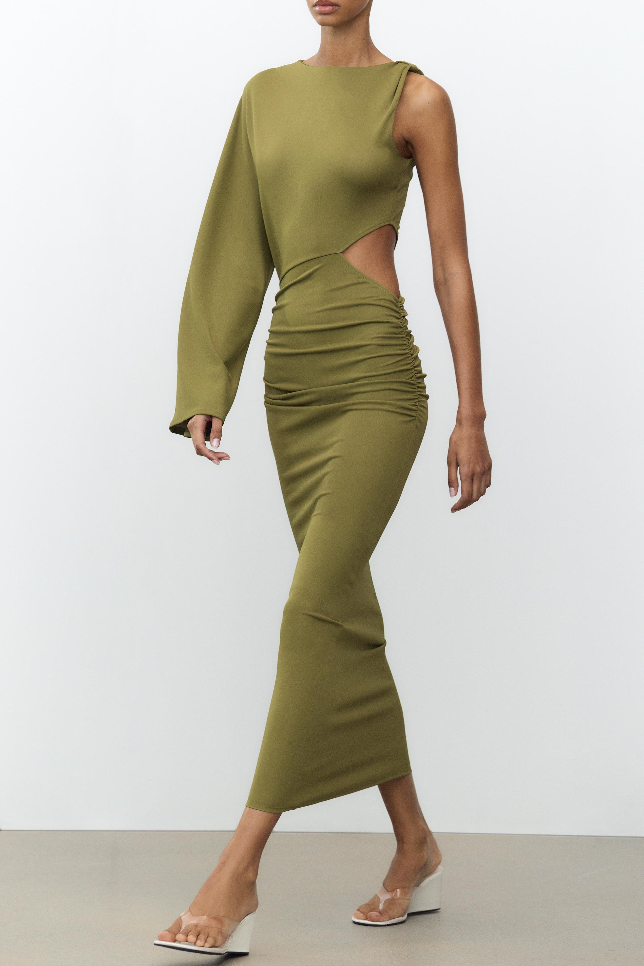 Flowing midi dress with a round neck. Sleeveless and long sleeve options available. Featuring a c... | Zara UK