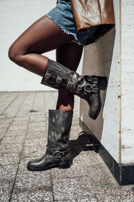 Boots for festival season! Brown distressed engineer boot with harness and buckle hardware adding an industrial edge and giving the design an adjustable fit 

#LTKshoecrush #LTKFestival #LTKSeasonal