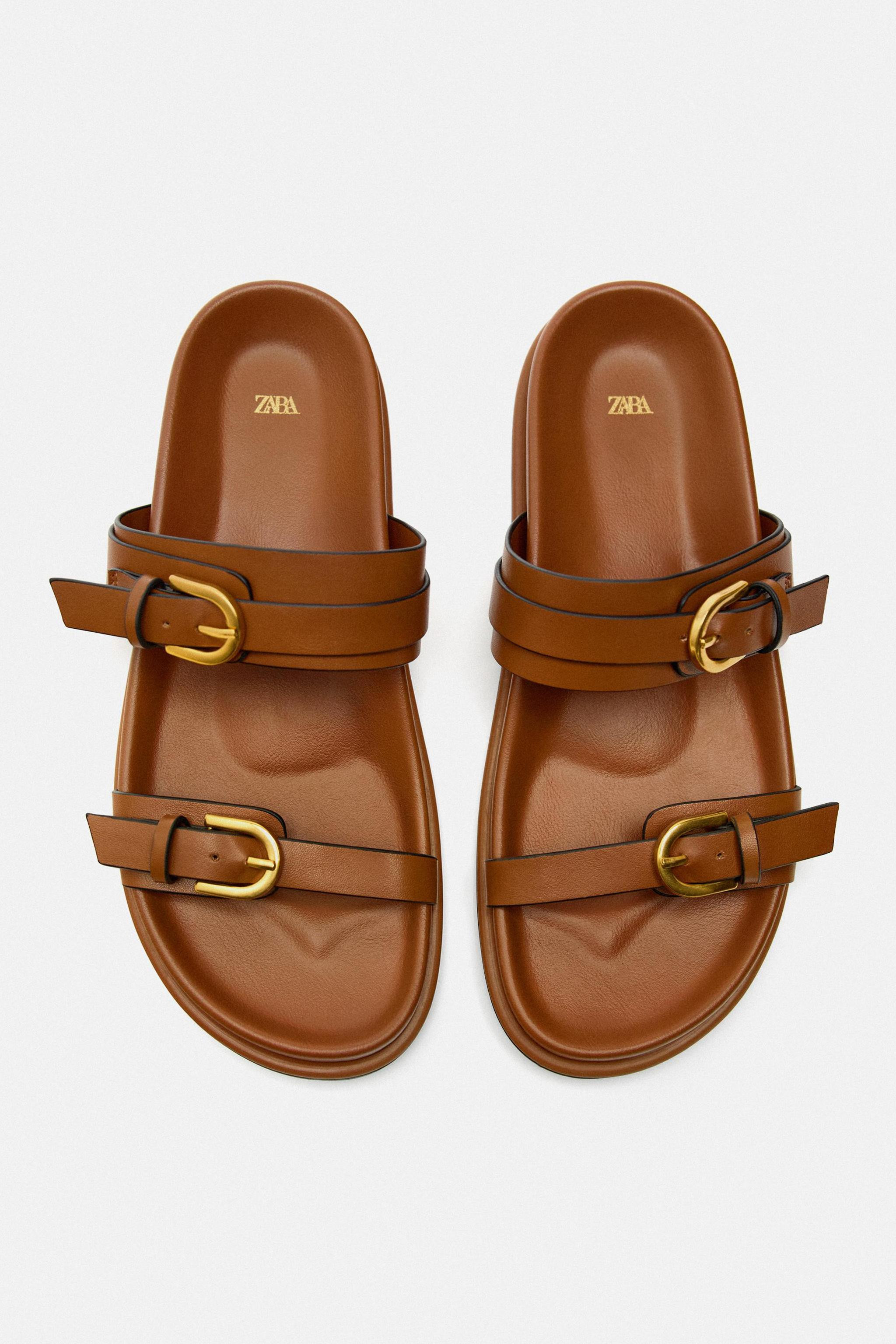 Flat slider sandals with straps and buckles. Round toe. Sole height: 2.5 cm. / 0.9″ | Zara US