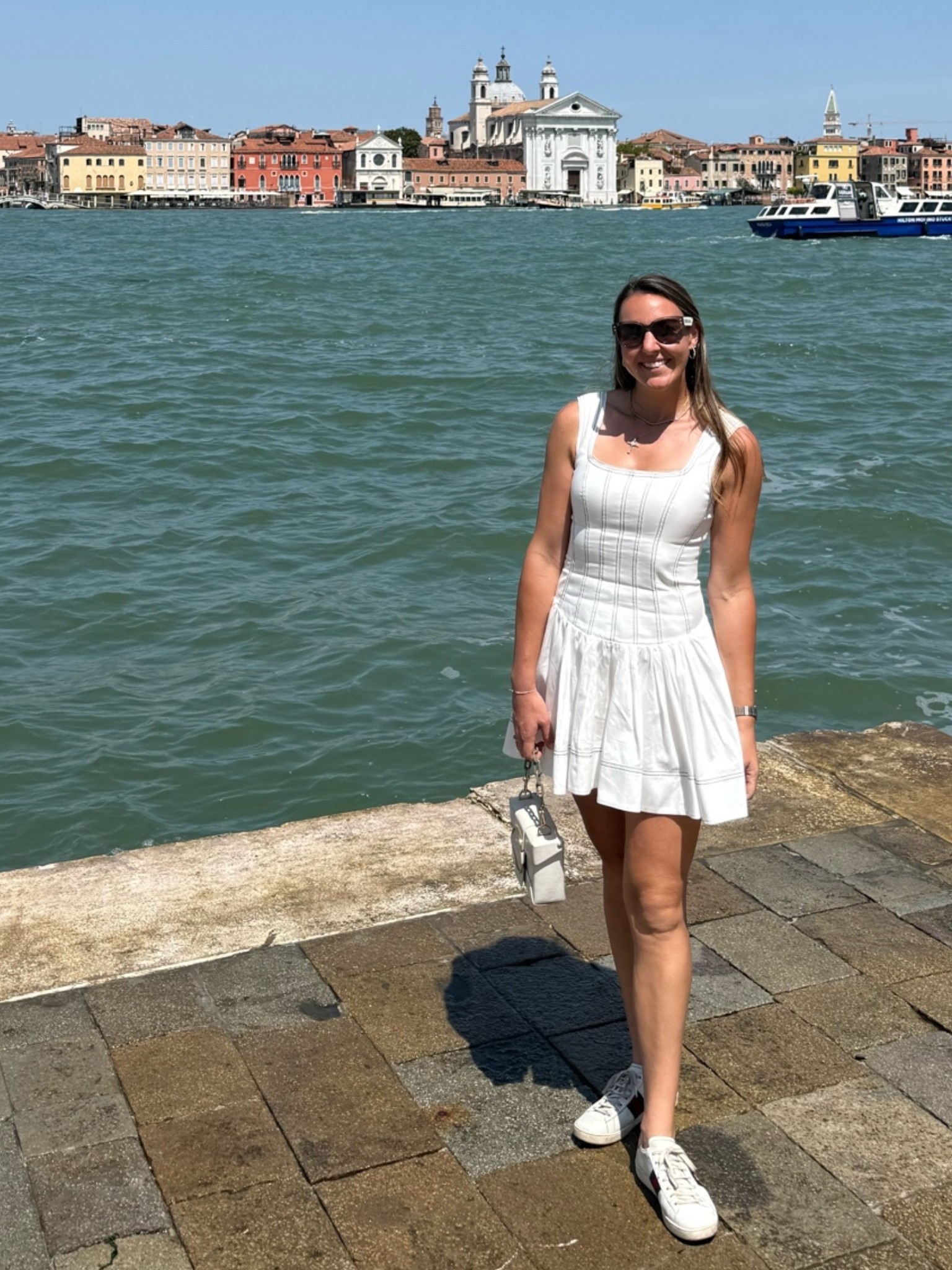 Beyond obsessed with a dress with a silhouette like this! #white #whitedress #travel #aje
