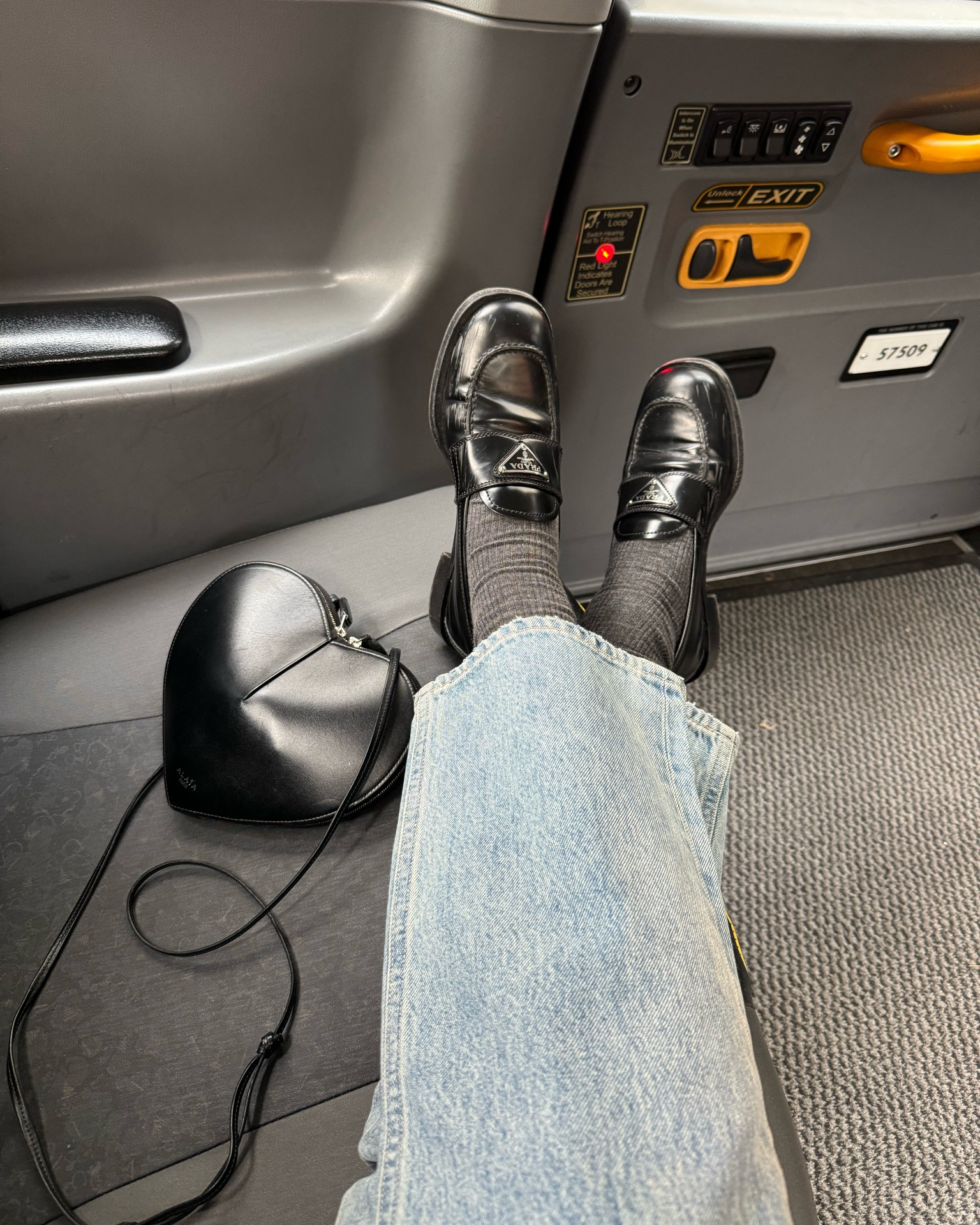 Prada Loafers + Grey Socks + Frame Jeans + Heart Bag 

#LTKuk #LTKstyletip #LTKeurope