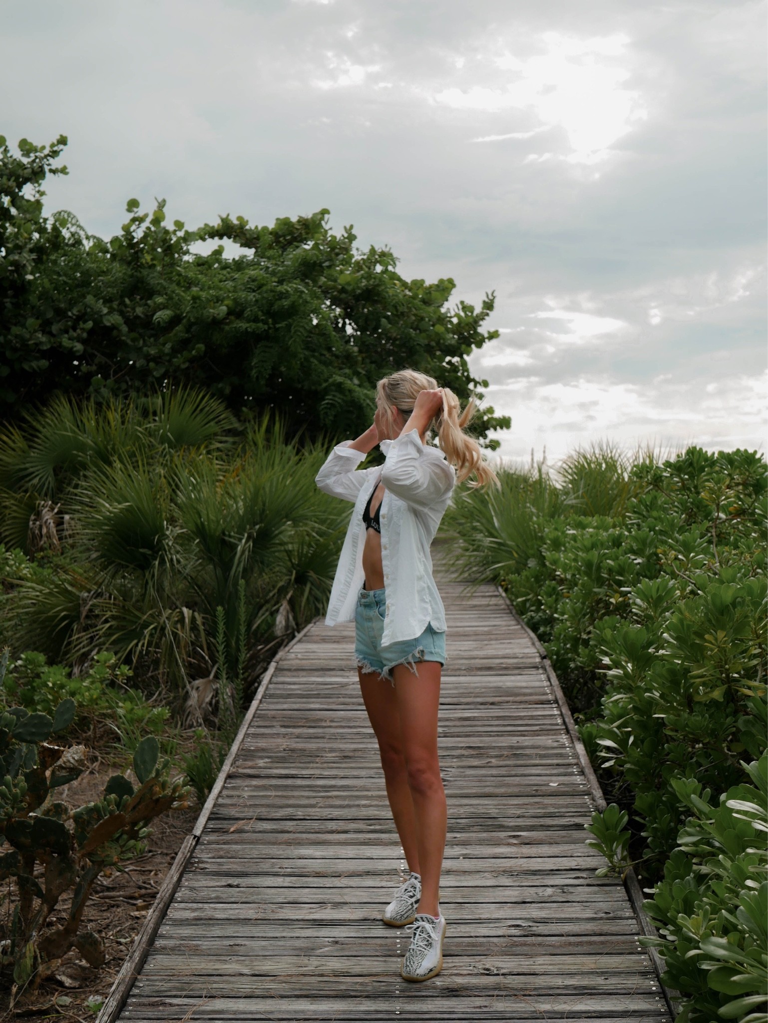Top: Ralph Lauren button up linked similar 
Top: Lounge Bralette in S (linked other cute bralettes) 
Shorts: Levi’s Linked 
Shoes: similar linked 