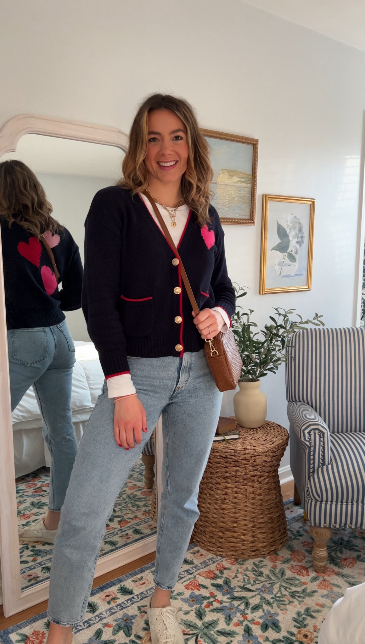 Today’s cute and fun ootd! This heart cardigan is so fun for Valentine’s Day! 🩷❤️ cardigan is currently on sale! 
Wearing a size medium in the tee and sweater, and a size 28L in the jeans (color is light). 

#LTKstyletip #LTKsalealert