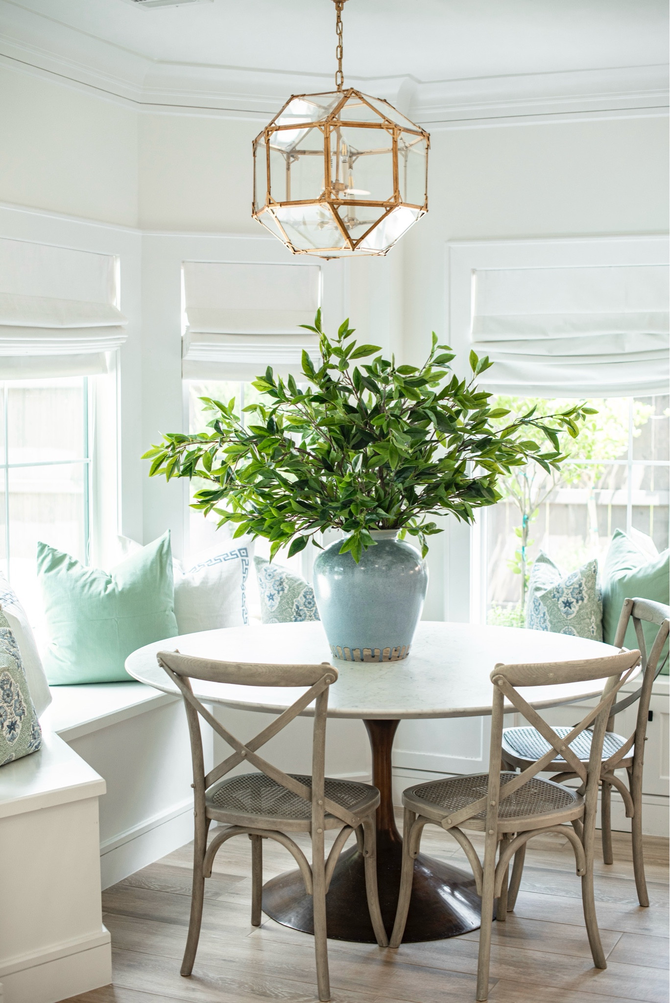 Breakfast nook with marble pedestal table decorated for Springg

#LTKfamily #LTKhome #LTKSeasonal