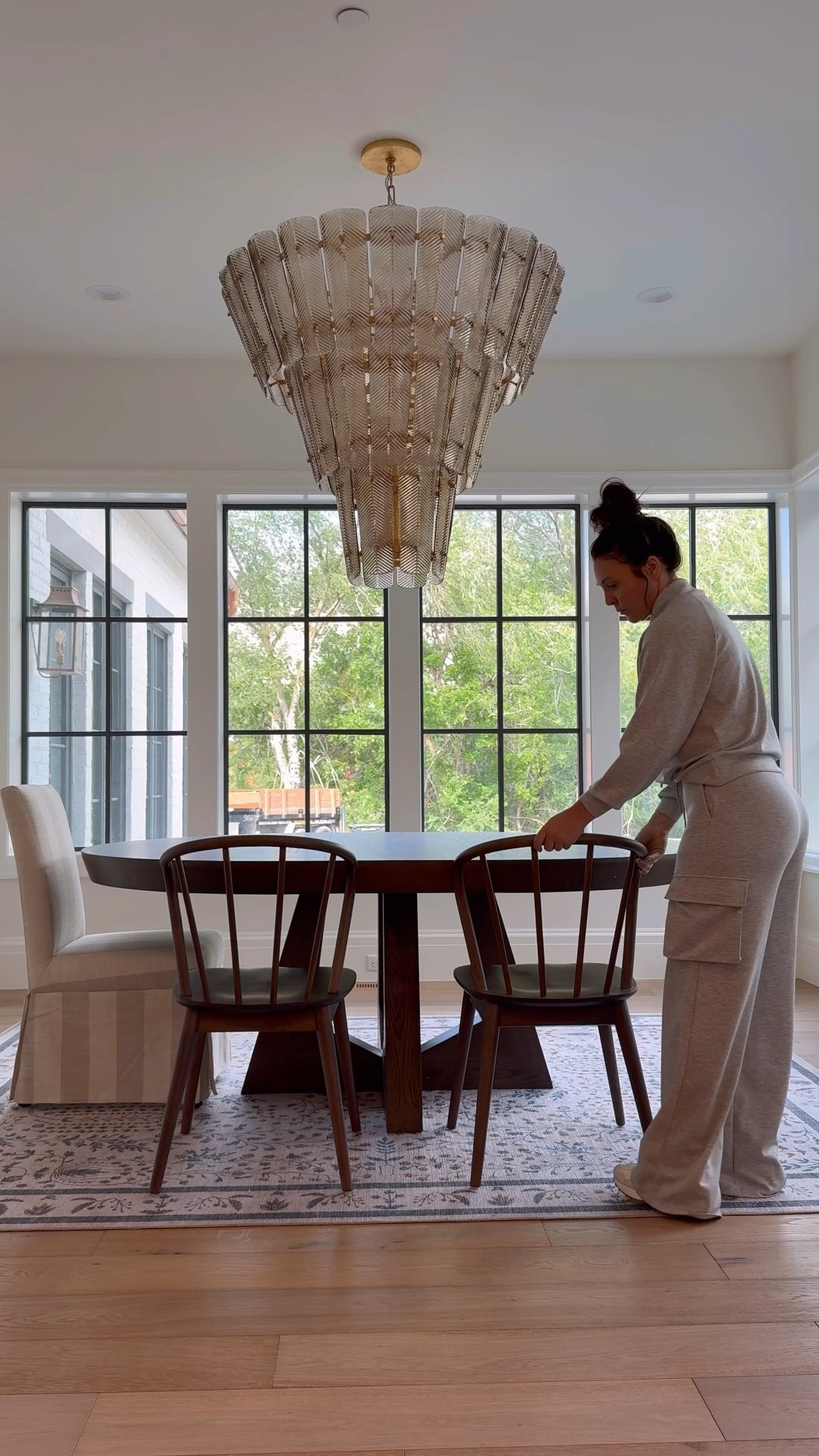 This table is SOLID and stunning! It comes with two leafs so can seat 8! We only have one leaf in now. 
The walnut chairs are finally restocked! Order these sell out fast! 
Striped upholster chairs come in other color and patterns as well. 

Love this rig so much! 
Chandelier comes in two sizes 

#LTKSaleAlert #LTKHome