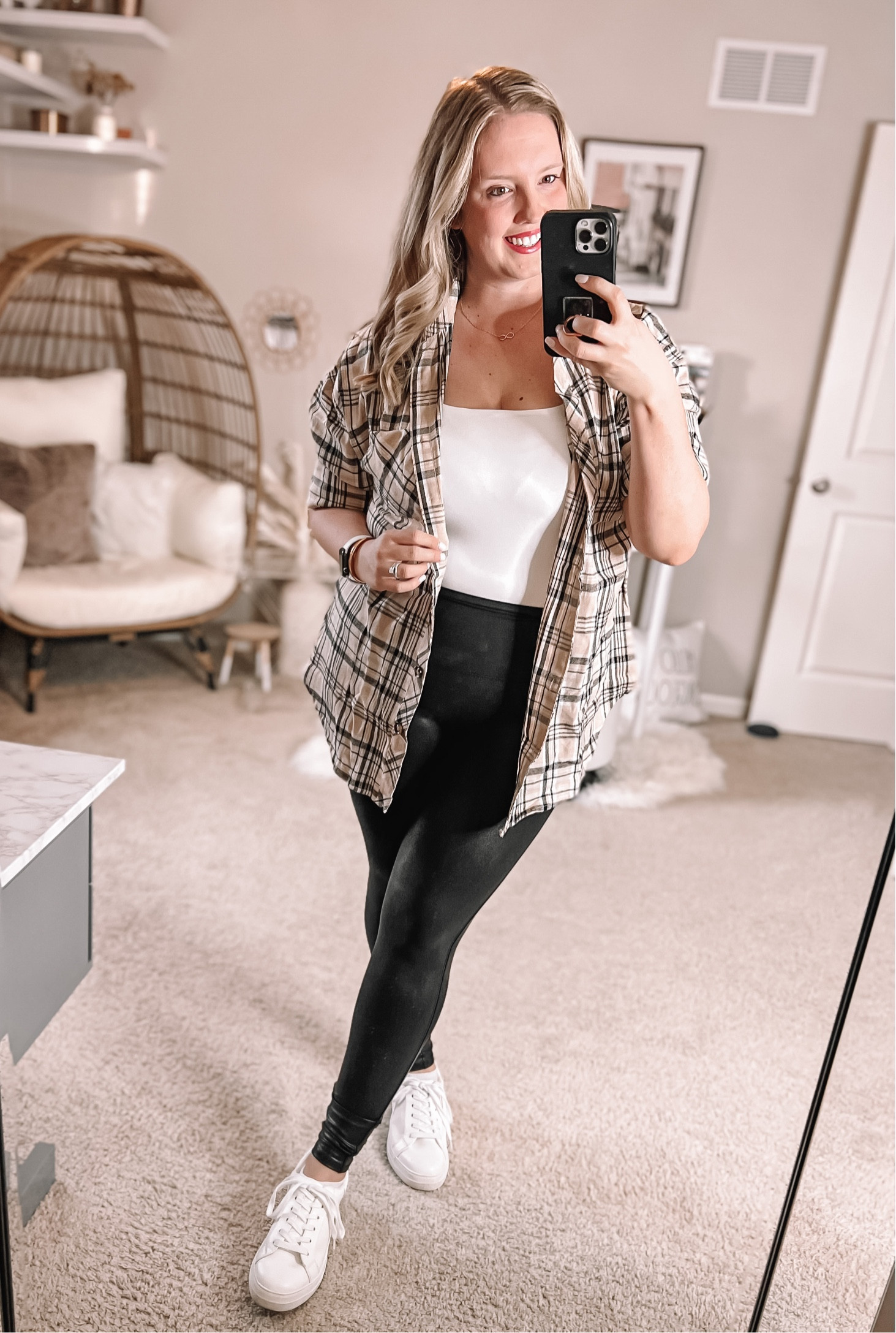 Elevate a casual flannel with faux leather leggings! This pair is highly rated and less than half the price of big name ones. This specific flannel is in th apricot color and is the SOFTEST flannel out there! I have 4 - white, apricot, green and red. Wearing XL, normally l/xl. 

White tennis shoes are the best pair I’ve owned. Reebok all white super sleek minimalist white tennies. Don’t sleep on the sleeveless white bodysuit either, great for when the weather gets warmer so you’re not too hot under your cute flannels. A black bodysuit and white bodysuit are closet staples for sure!

#LTKSeasonal #LTKsalealert #LTKunder50