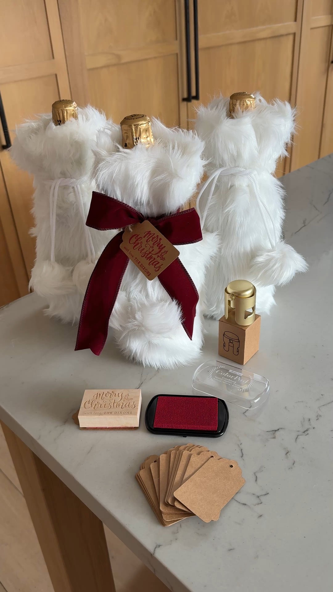 DIY holiday host gift🍾 
+ champagne
+ faux fur bottle bag
+ champagne stopper
+ velvet bow
+ custom Christmas stamp 

#LTKGiftGuide #LTKHoliday #LTKHome