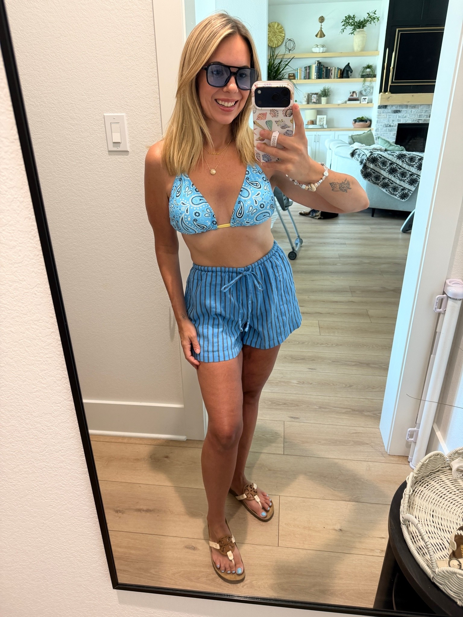 Wearing my true small in shorts but sides up to large top and medium bottoms. This area swimsuit is the best.