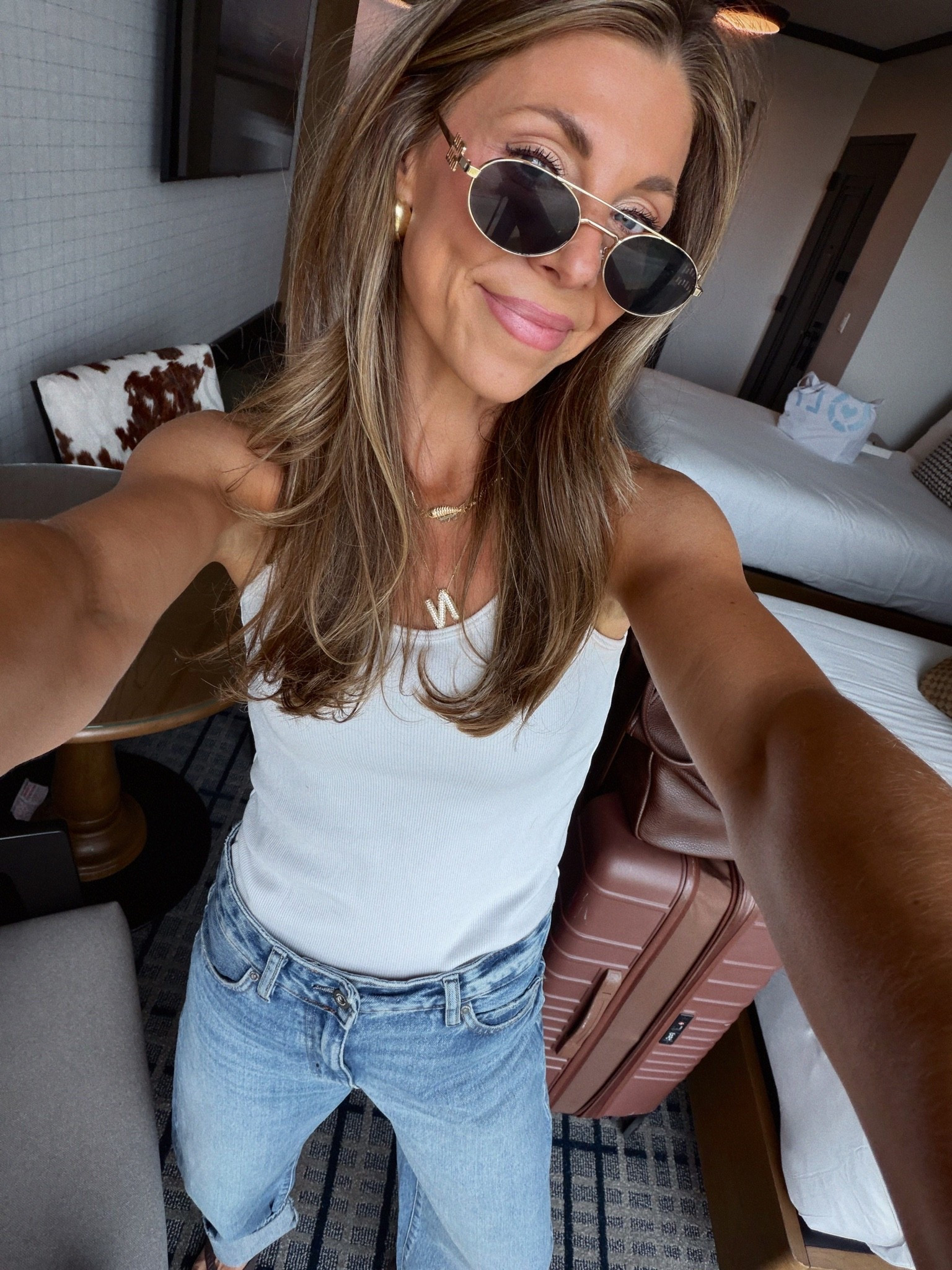 These jeans!! Just bought at Zara! TTS but a baggy fit! Old tank and Beis luggage and an Amazon tote! Kits blue light glasses.

#LTKCon #LTKootd #LTKdayinmylife