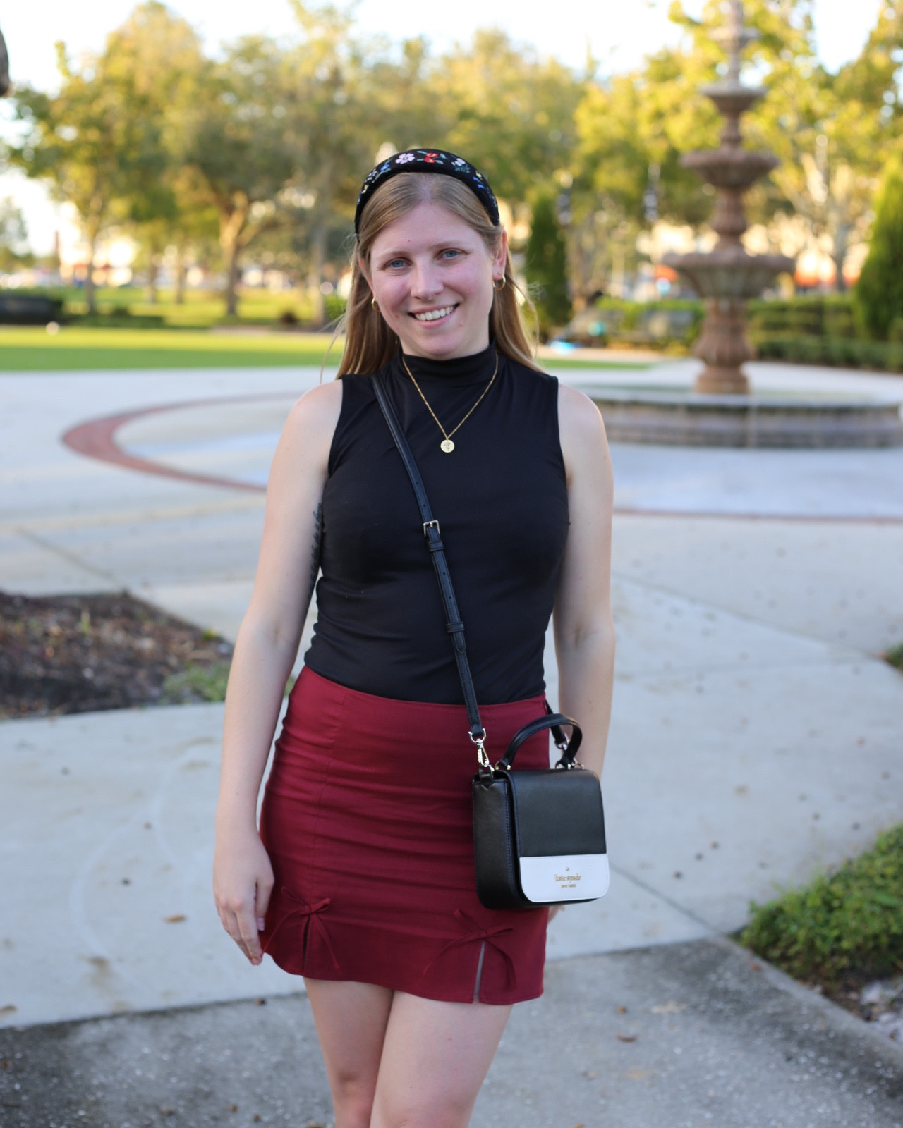 Chic and trendy fall outfit. Burgundy bow mini skirt and mock neck tank  