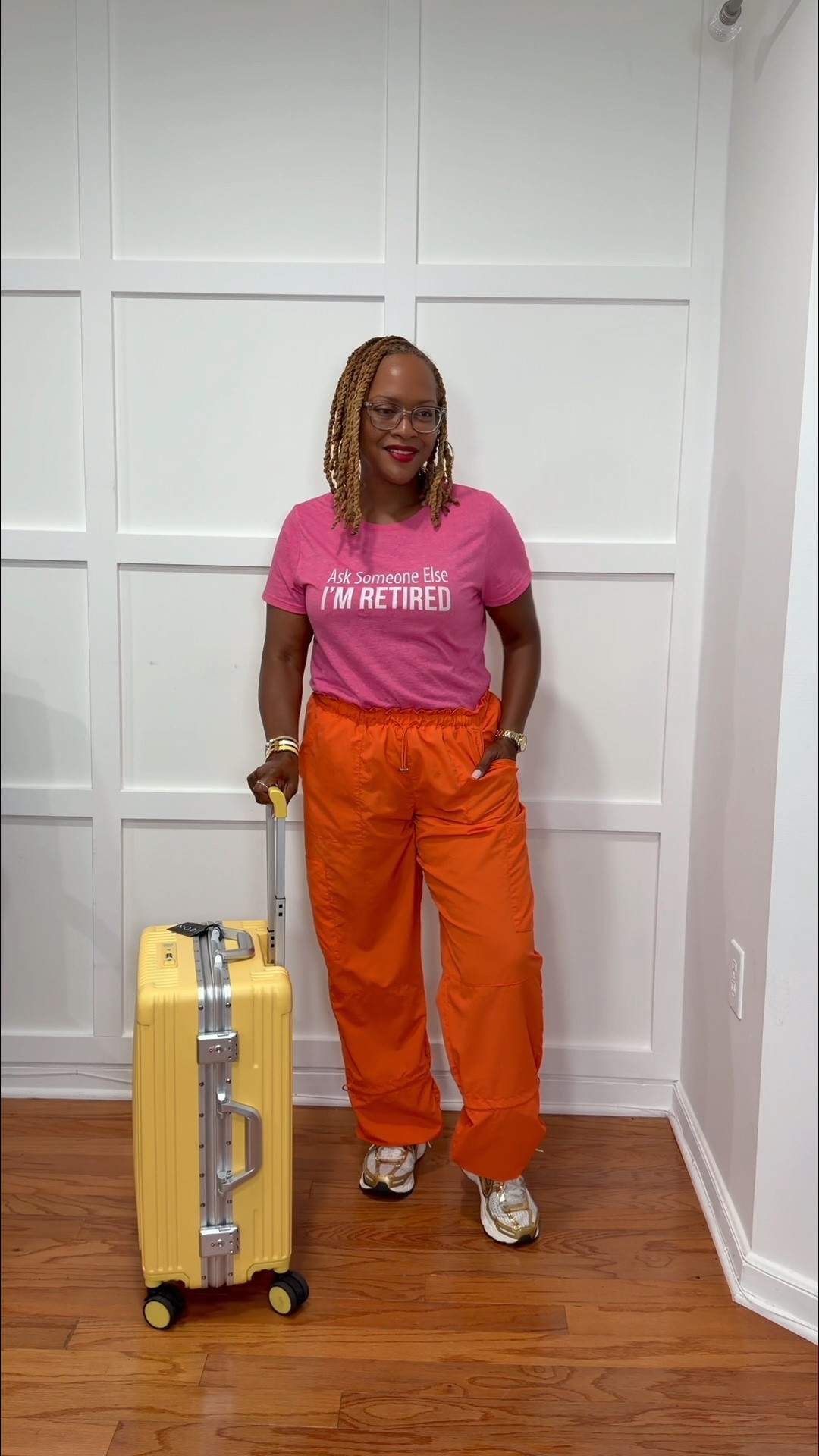 Travel outfit 
Retired tee shirt
Orange cargo pants available in multiple colors
Yellow carry on suitcase
Nike Gold Sneakers

#LTKootd #LTKvlog