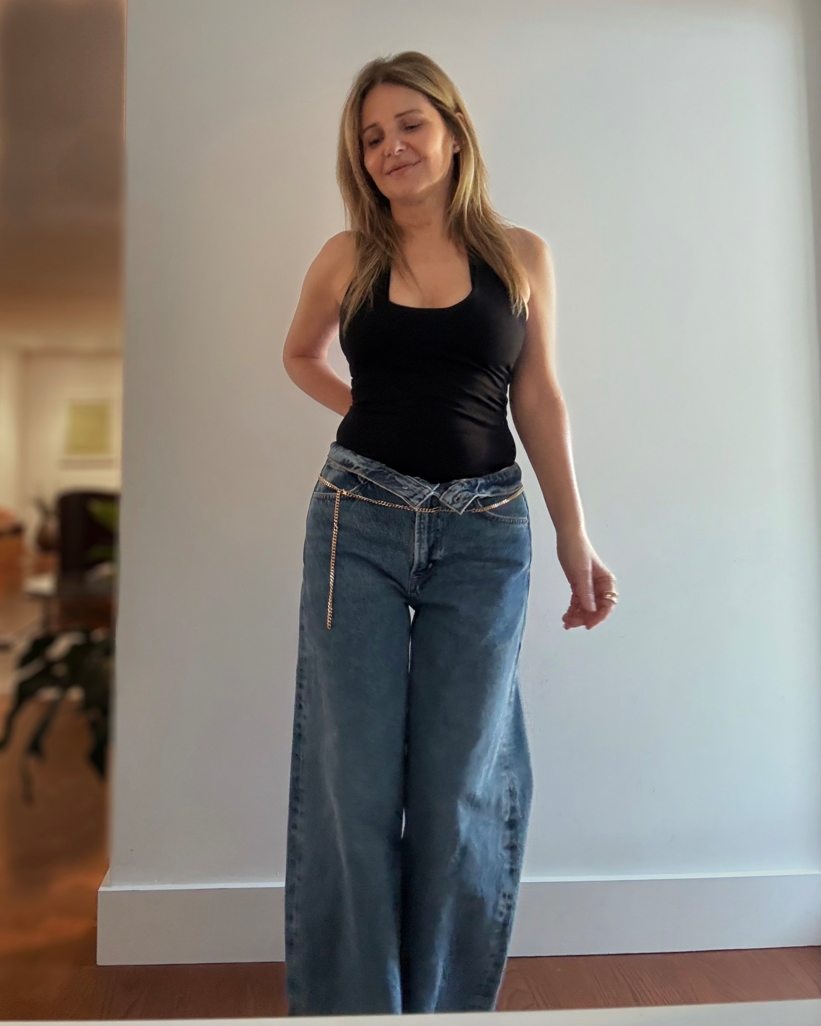 Outfit I wore to the Heat game last night: black halter neck top from Free People, these are my AGOLDE low curve jeans just flipped the top down (size 26, color myth) and added a gold belt from Jacquemus. My shoes are black mesh ballet flats from Reformation (shown in my other pics)

#LTKootd #LTKSeasonal #LTKSaleAlert