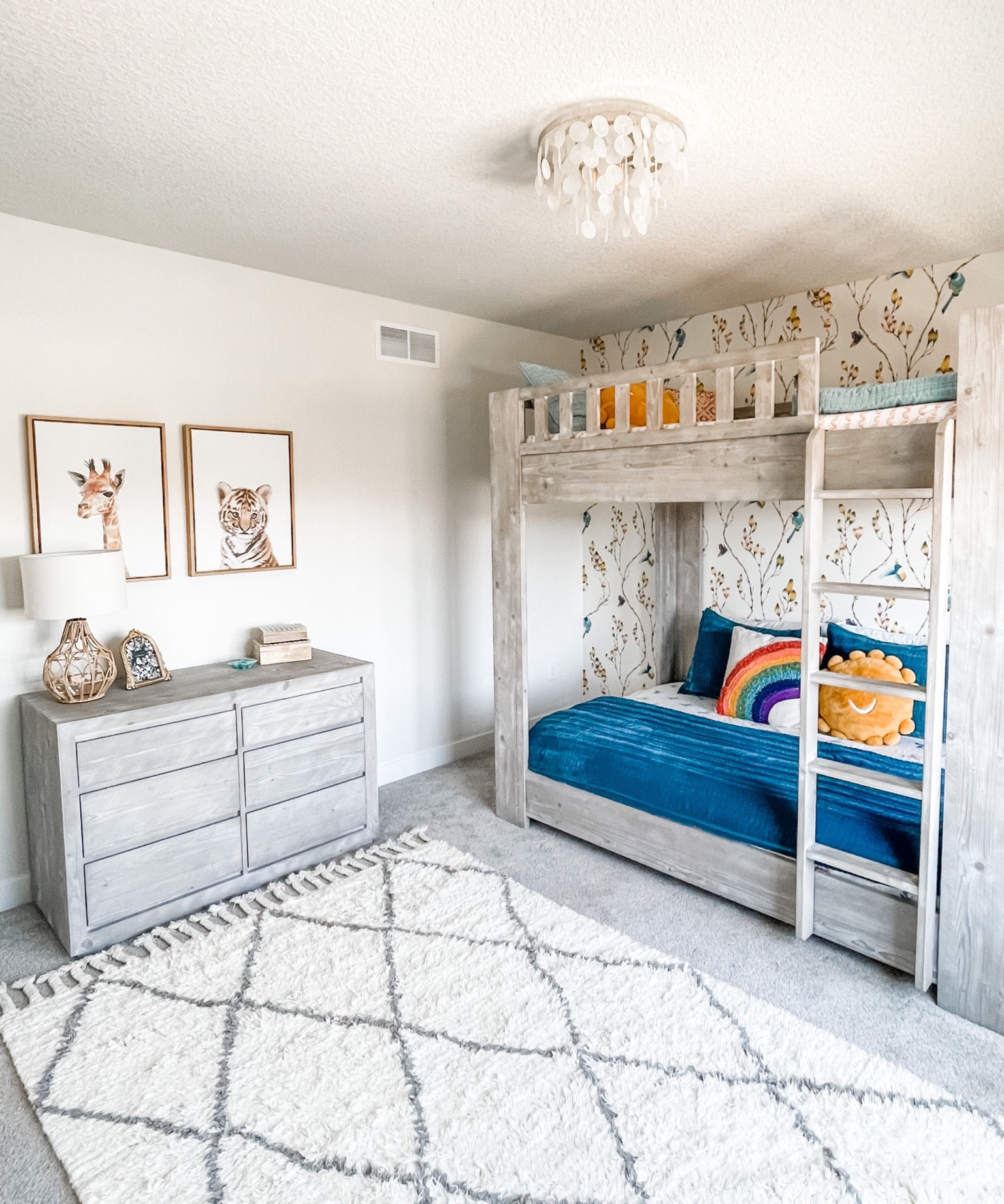 What little girl bedroom dreams are made of. ☁️✨

Baby animals, the cutest wallpaper 🦜, a fun new 🐚 light and custom neon name sign 🌟are just a few of the highlights that brought this special space to life. 

A neutral grounding palette means this room can grow with Tara as she does. But until then, it’s all ☀️ and 🌈 for this sweet girl! 💖

Tip:
✨Invest in key pieces like this RH bed and dresser that will stand the test of time. 
✨Layer in budget friendly bedding and decor that can easily be swapped out to fit any age or season.
✨Adding wallpaper to even just one accent wall adds maximum impact. Choose peel and stick if you’re not totally ready to commit.
✨Swapping out standard flush mounts for fun lighting is an easy way to add that extra wow factor!

#LTKhome #LTKkids #LTKstyletip
