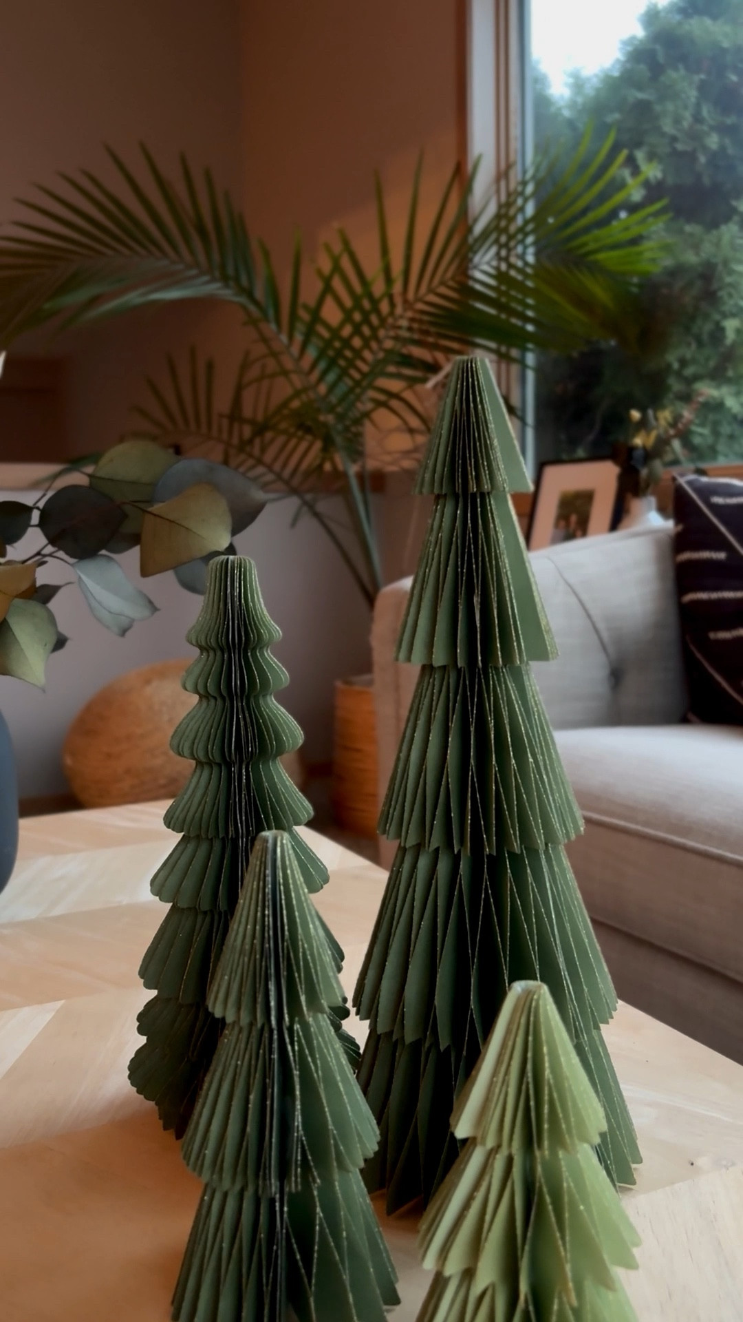 Adorable paper Christmas trees simply unfold for a lovely little forest. These would be so cute on the coffee table, shelf, or mantle. Lots of green colors super neutral holiday decor.

#LTKHome #LTKHoliday #LTKSeasonal