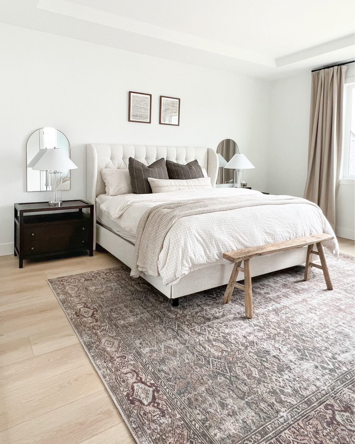 Modern home decor, primary bedroom, neutral home decor, cozy bedding, Amazon home find, Target decor, Amber Lewis Loloi rug, dark wood nightstands, affordable accent lamps, arched mirror, taupe black put curtains, pleated curtains, master bedroom furniture, tufted Wayfair bed frame, cream bed, tan upholstered king bed, transitional home decor, modern farmhouse, organic home, Homebyjulianne 

#LTKhome #LTKFind #LTKunder100