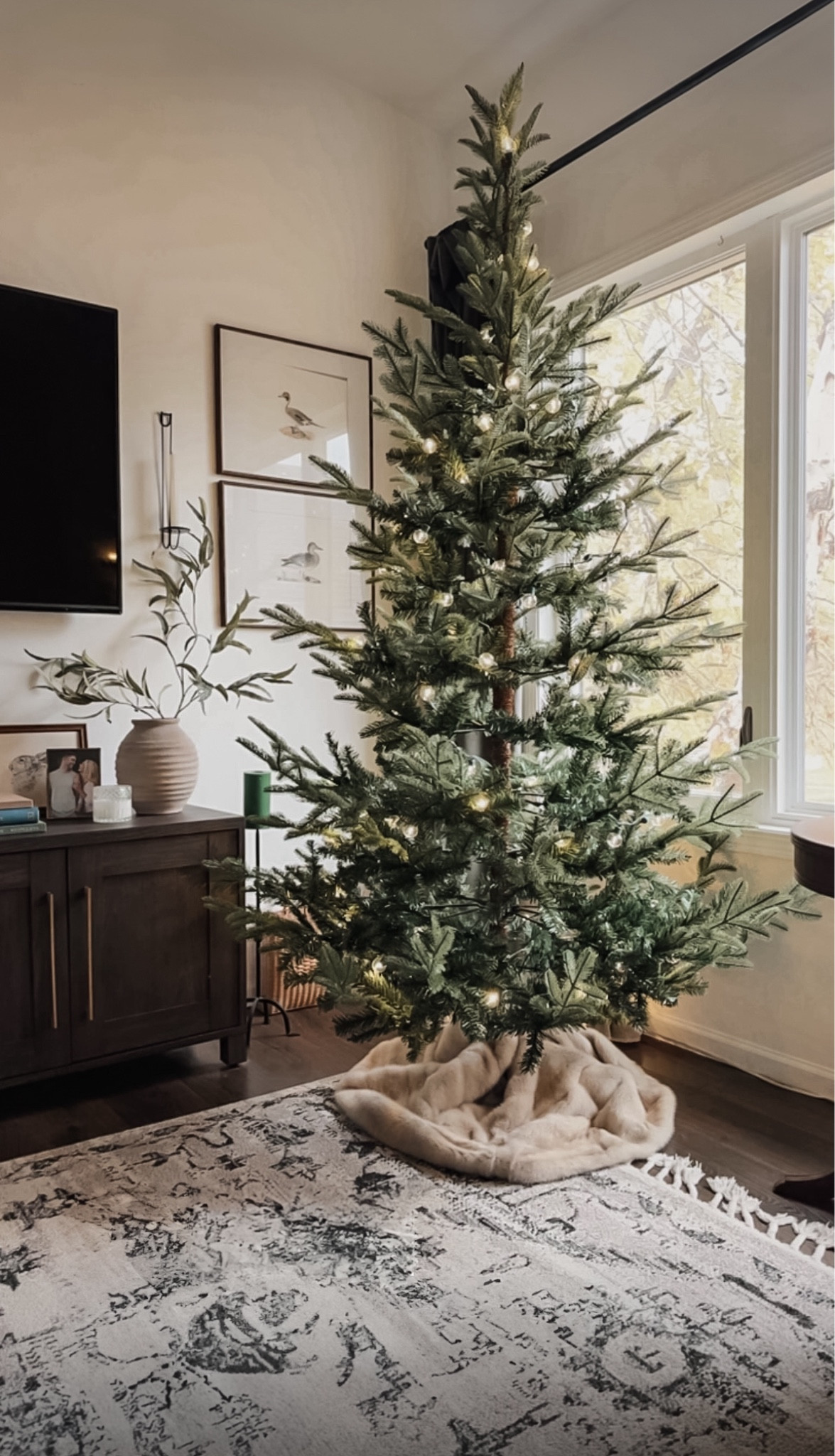 The prettiest tree in all the land. It looks so real and cozy, and is the perfect height— not too big but not too small. Grab it now while it’s the lowest price I’ve seen! (I’ve been watching for months!) I added one strand of these lights to give it a magical glow  

#LTKSaleAlert #LTKSeasonal #LTKHoliday