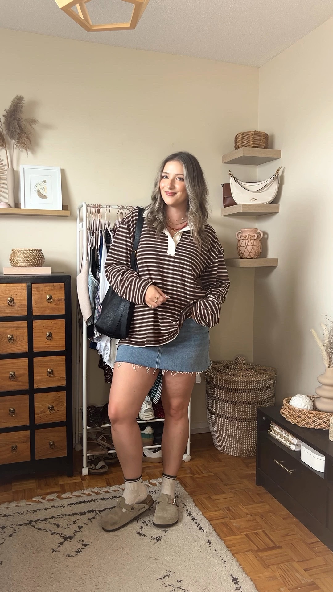 Early fall outfit! Wearing L in the striped rugby polo top, it’s very lightweight so still works for warmer weather! I bought this denim skirt last year in a size 32, would do a 31 if I was purchasing now. I’m a 9.5-10 shoe and wear a 40 in the Birkenstock clogs

#LTKfall #LTKmidsize #LTKstyletip